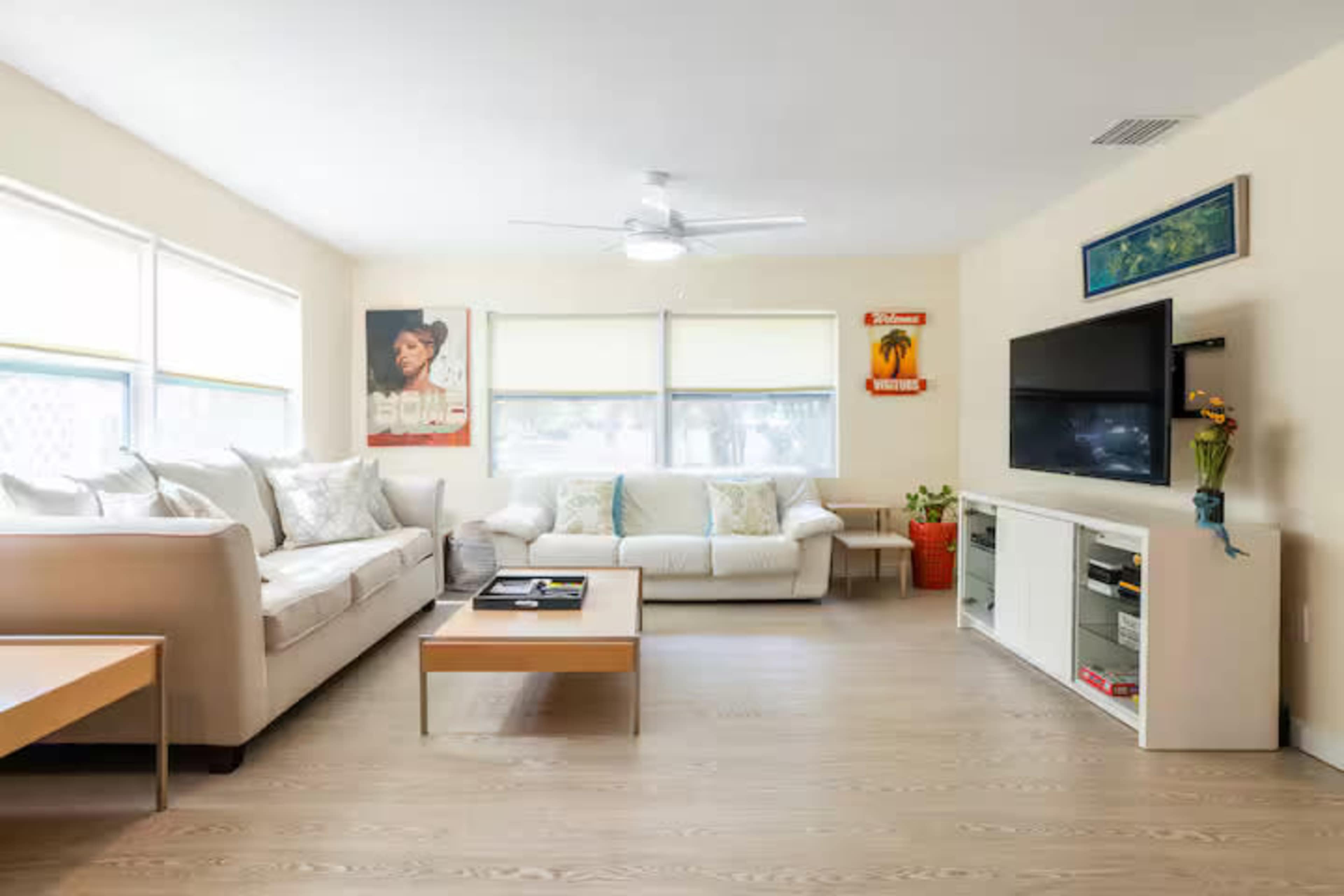 Cheerful downtown home flanked by empty green spaces Image in Gillespie Park, Sarasota, FL
