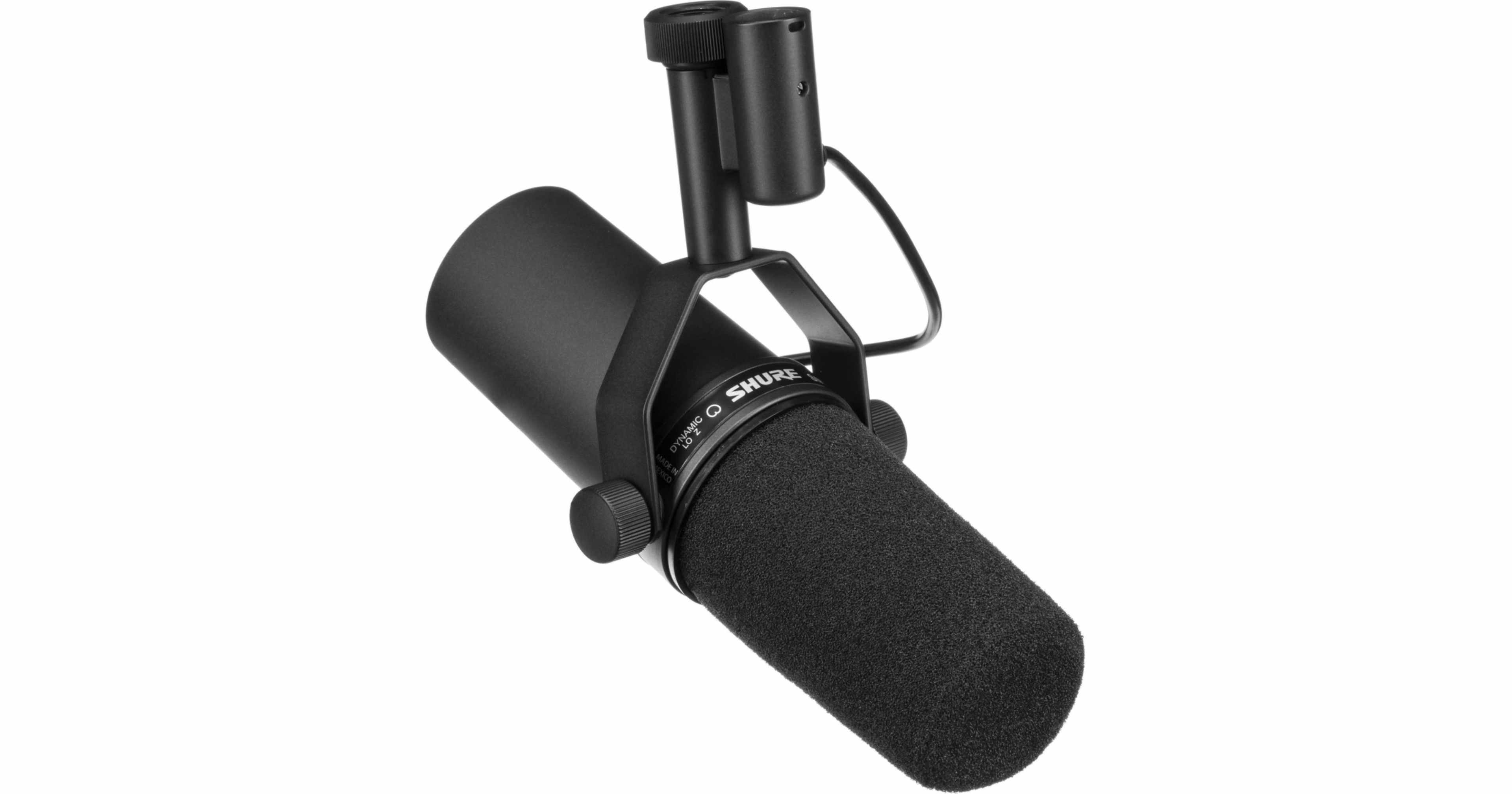 The image shows a black Shure microphone mounted on a shock mount.