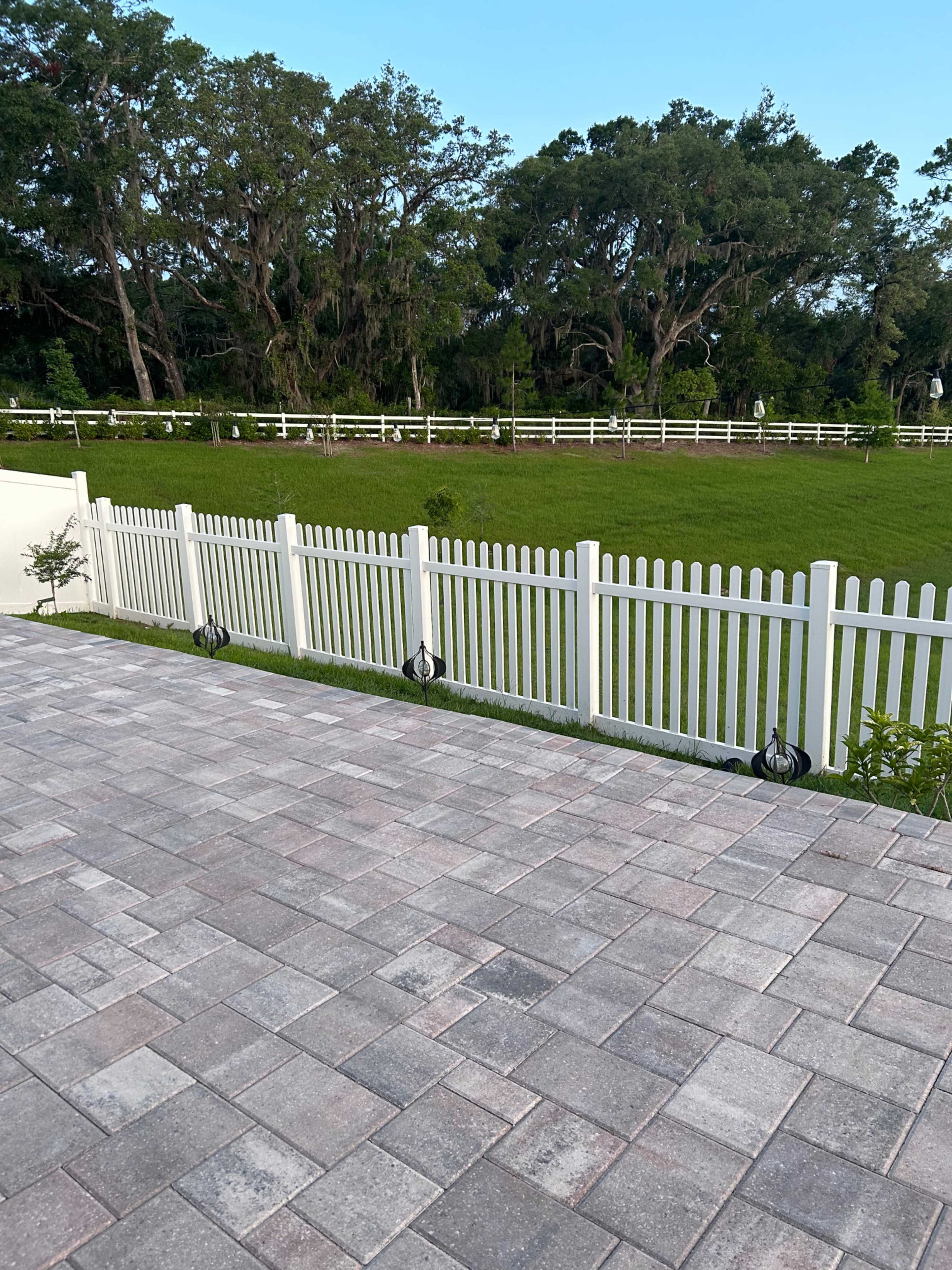 Charming Outdoor Photography Space with Greenery + White Picket Fence Backdrop Image in Leesburg, Okhumpka, FL