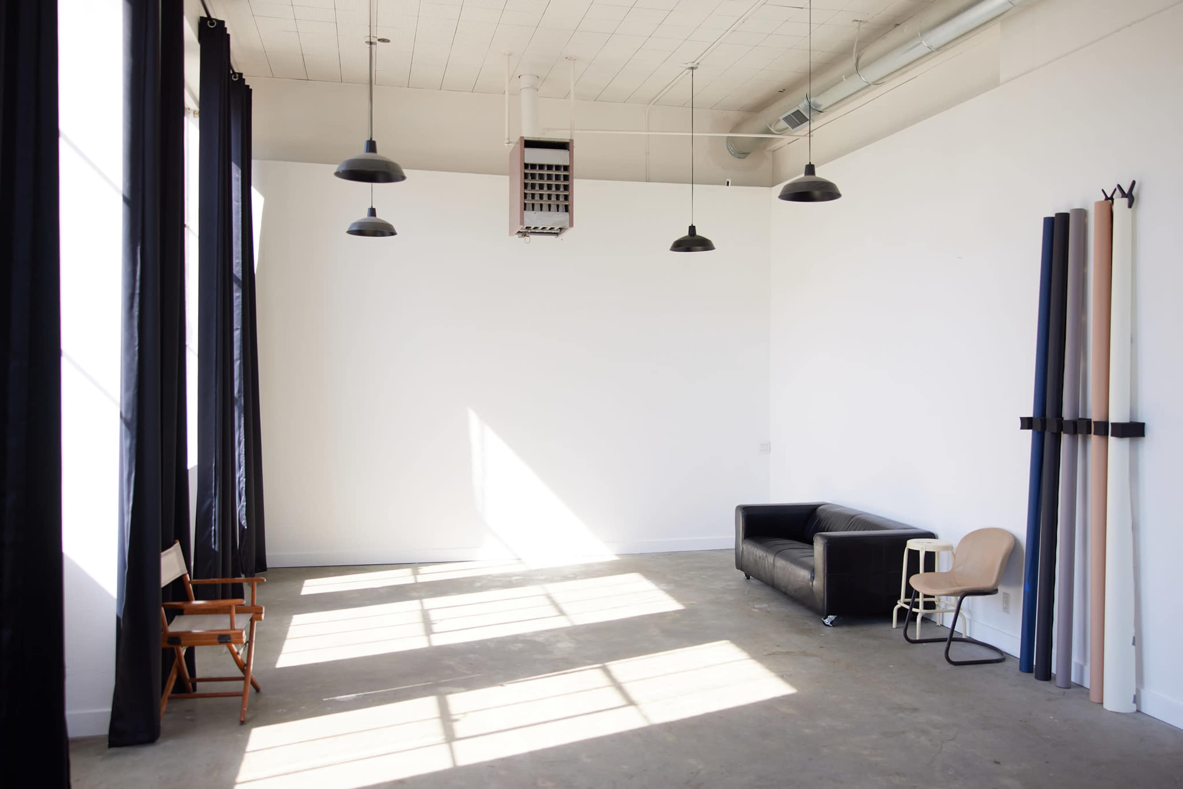 Clean White Studio with Concrete Floors & Natural Light Image in SODO, Seattle, WA