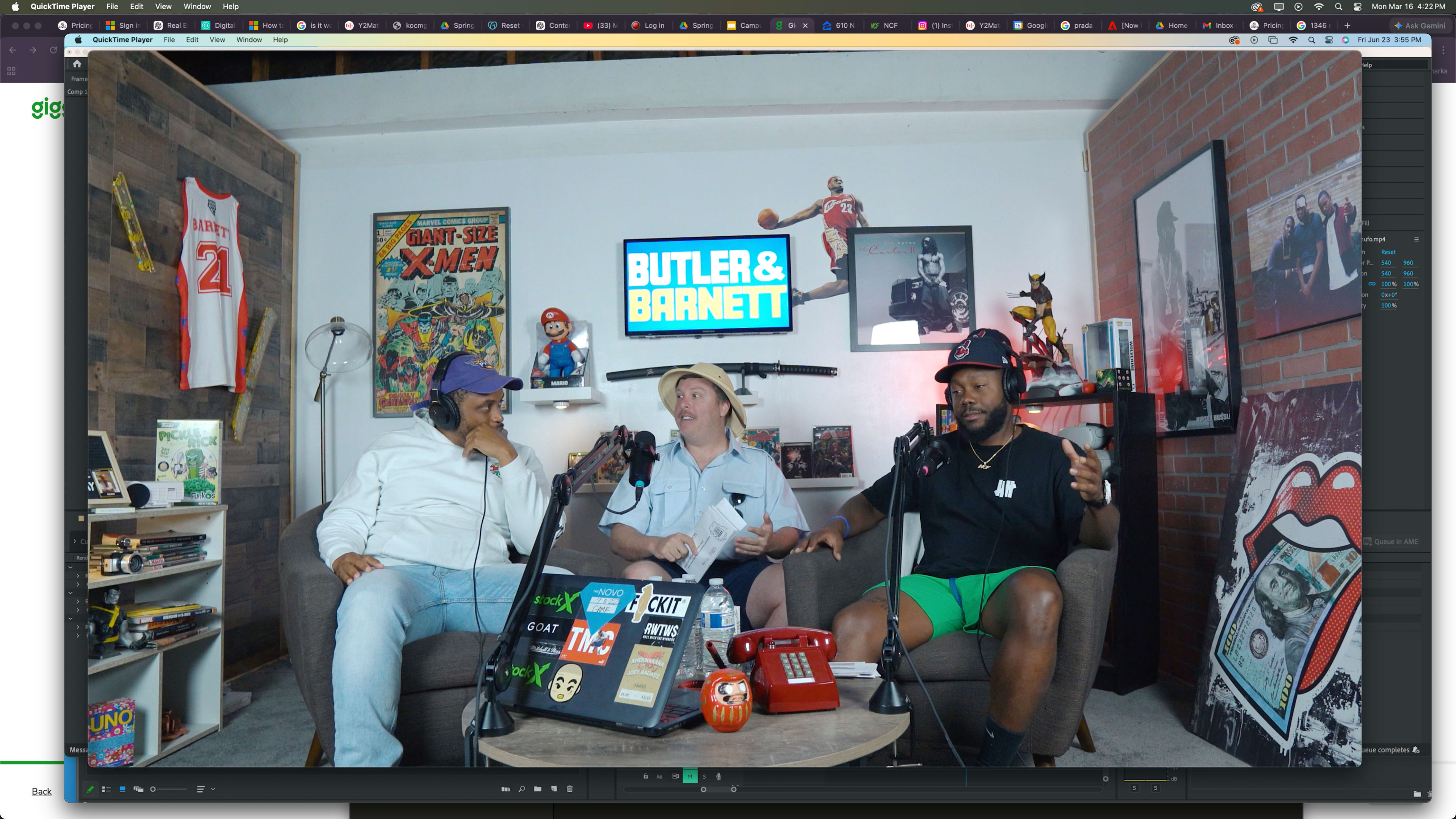 Three men sit on a couch in a modern studio decorated with sports memorabilia, discussing topics while surrounded by various gadgets and a vibrant backdrop.
