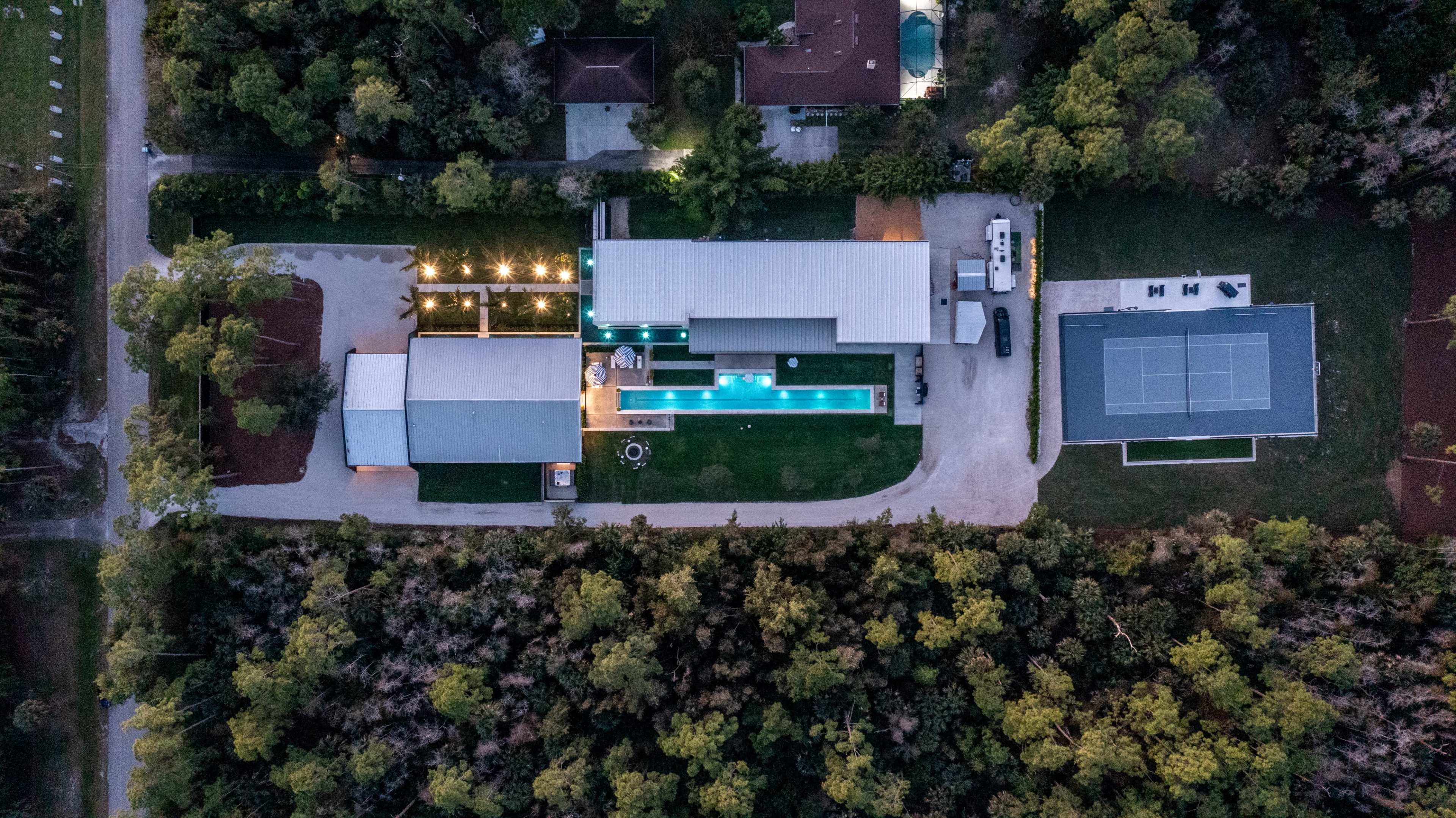 2.5-Acre Estate w/ Cinema, Gym, Pool, Pickle Ball, Hot Tub, Cat Walk, Pool Table - Industrial Modern Aesthetic Image in Urban Estates, Naples, FL