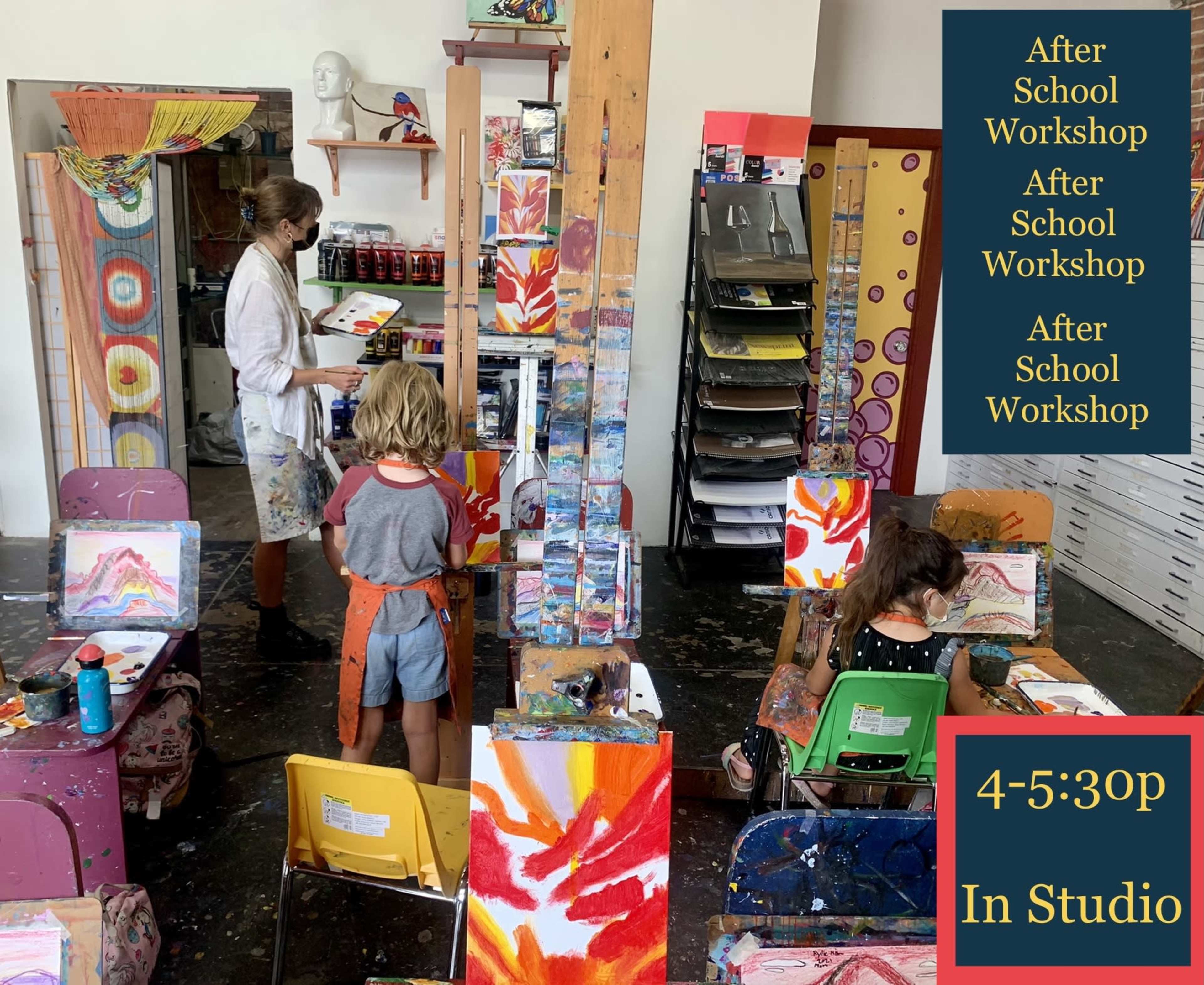 A woman guides children at easels in an art studio during an after-school workshop.