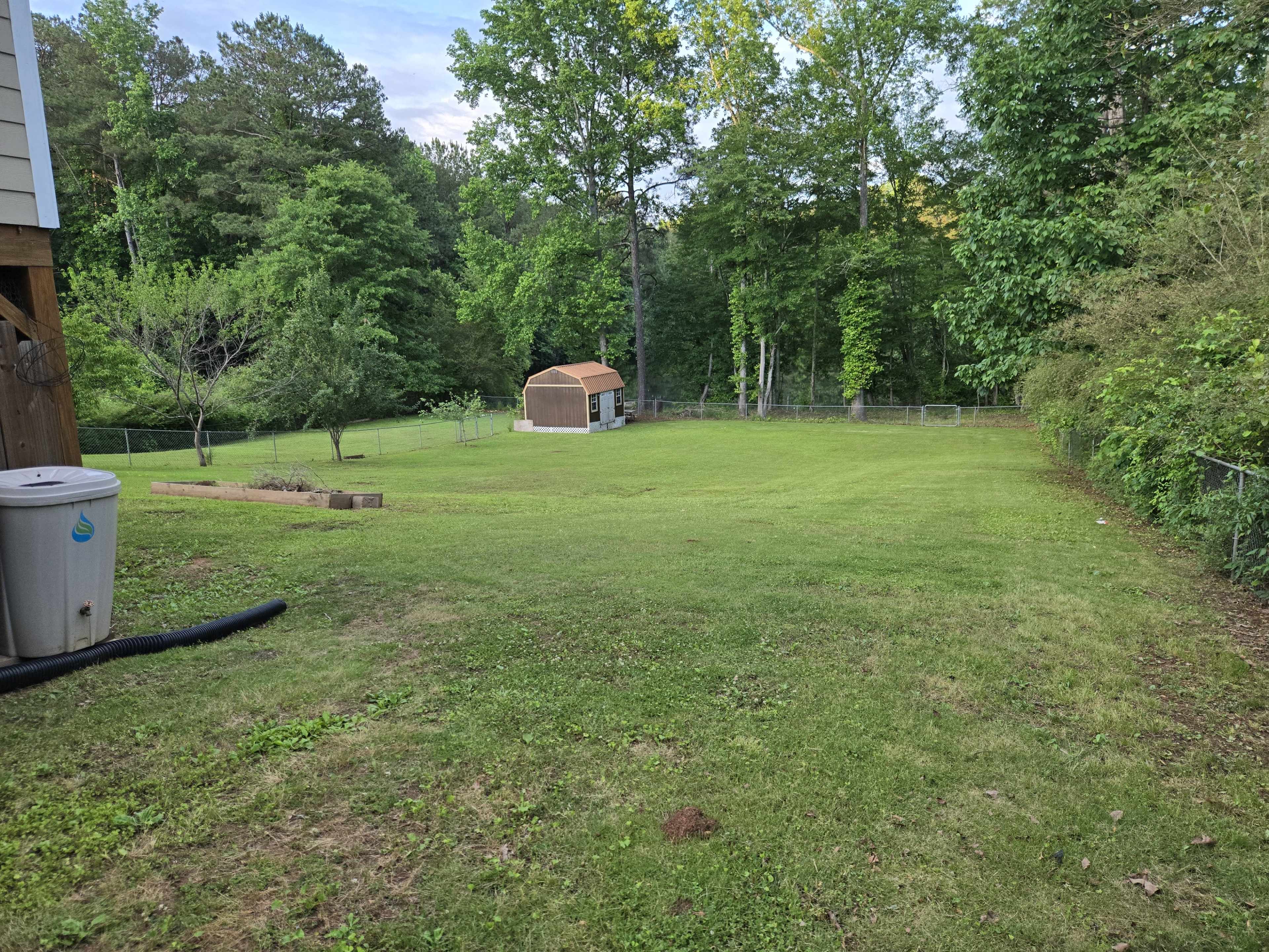 Large backyard with pond view Image in , Stockbridge, GA