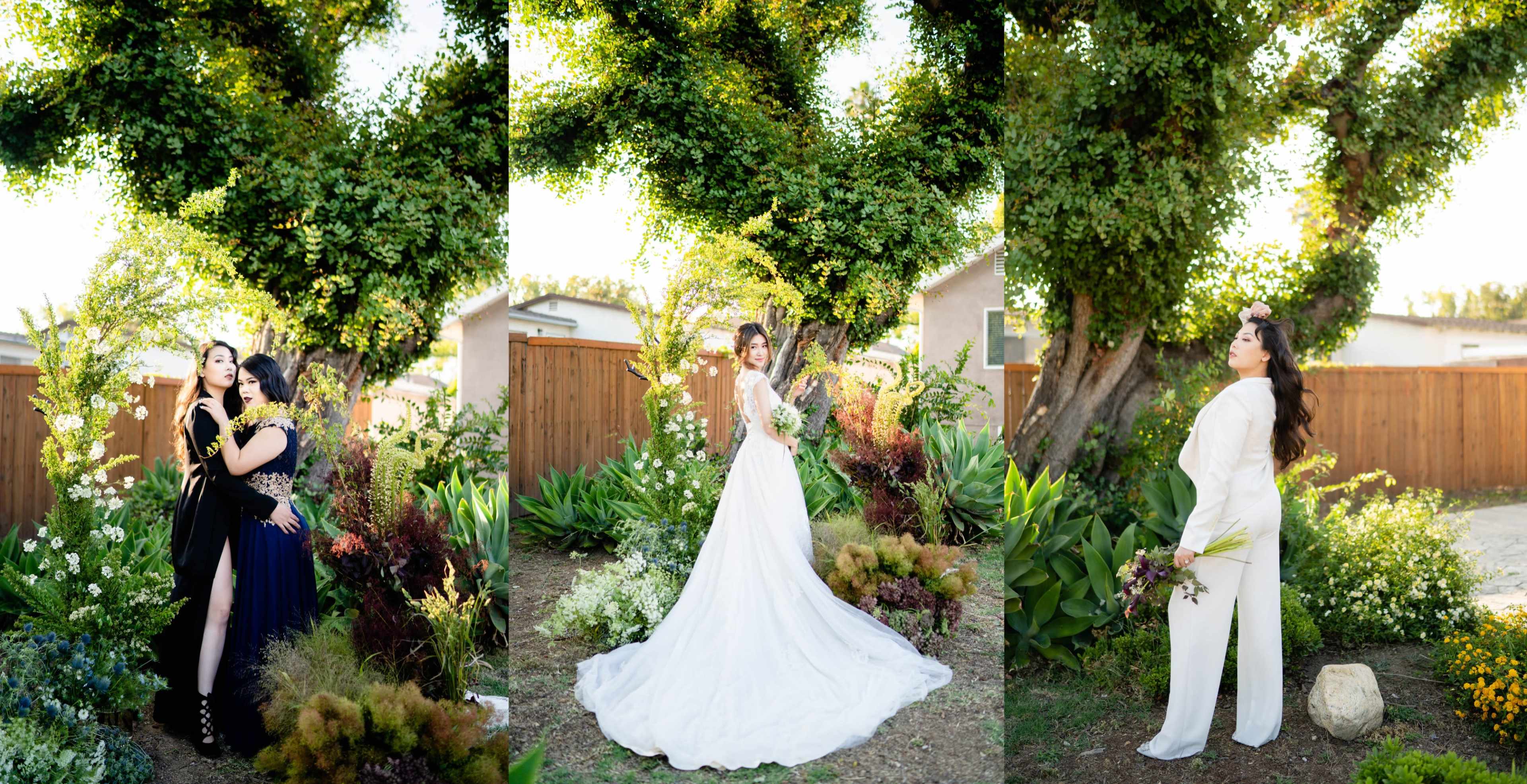 Three women posing in a garden setting, surrounded by lush greenery and flowering plants.