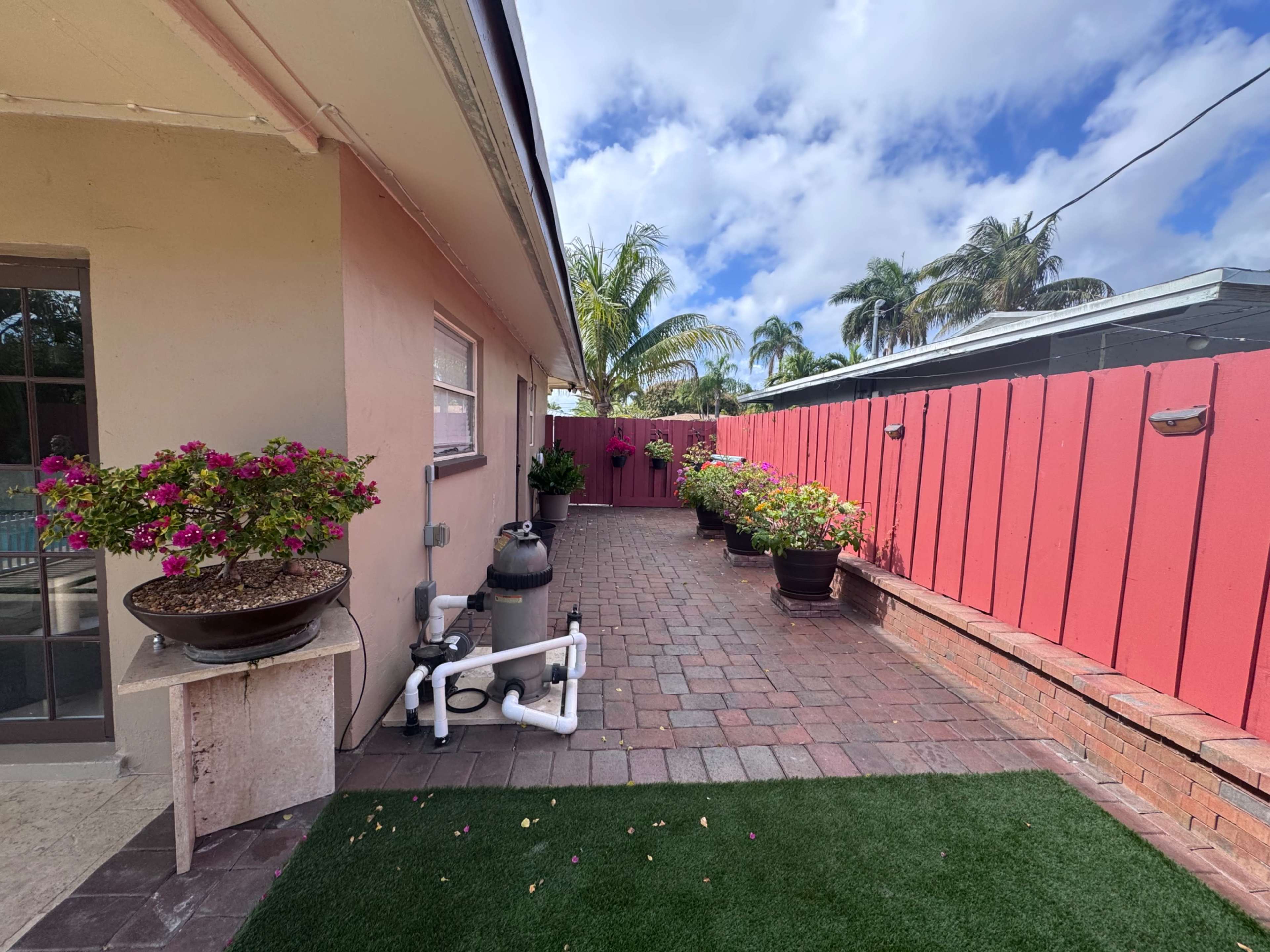 Spacious Backyard with Pool and Outdoor Kitchen Image in Pompano Beach, Pompano Beach, FL
