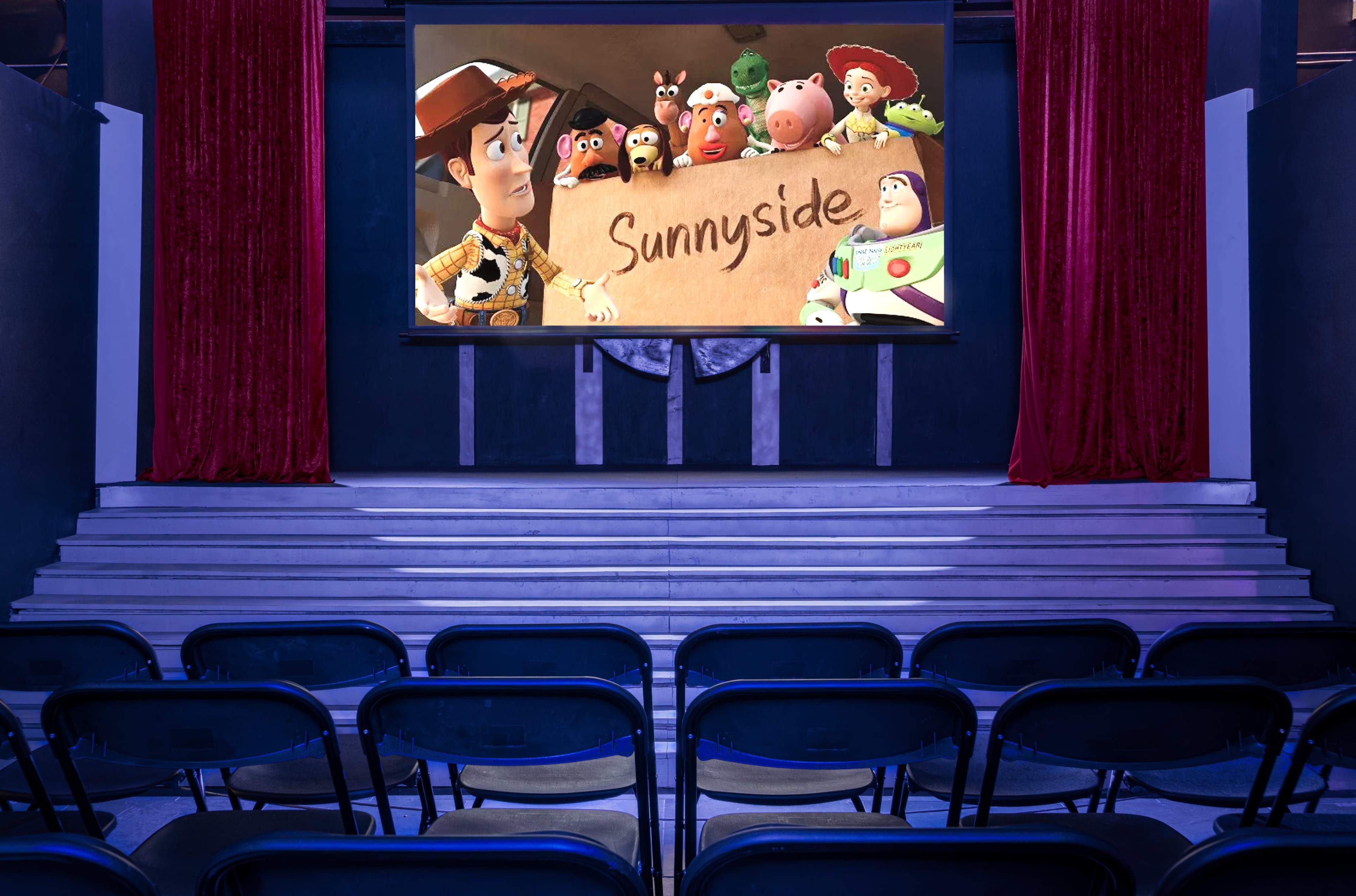 A movie theater features a large screen displaying animated characters in front of empty black chairs.