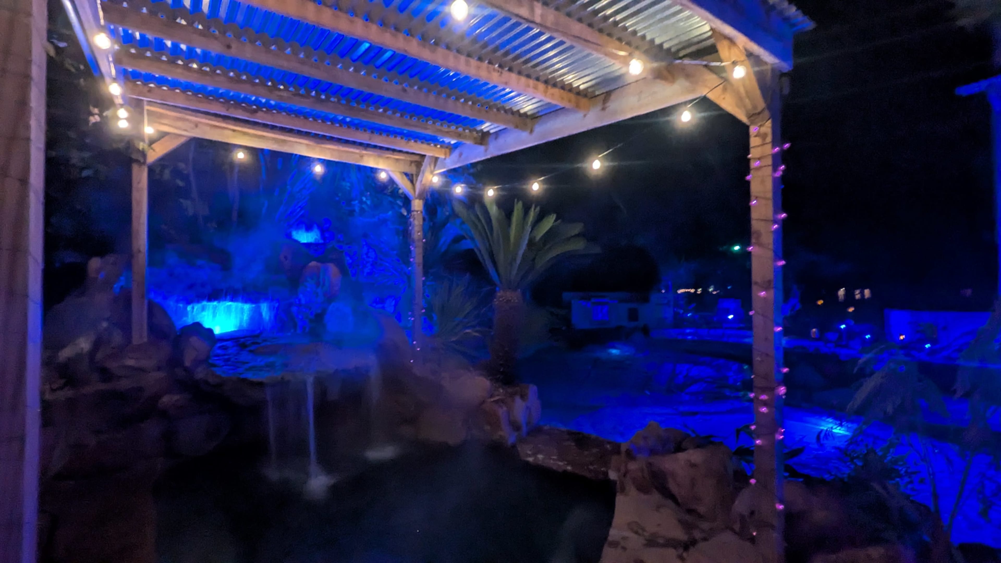 Stunning Tropical Pool and Spa With Boho Interior Image in , Conroe, TX