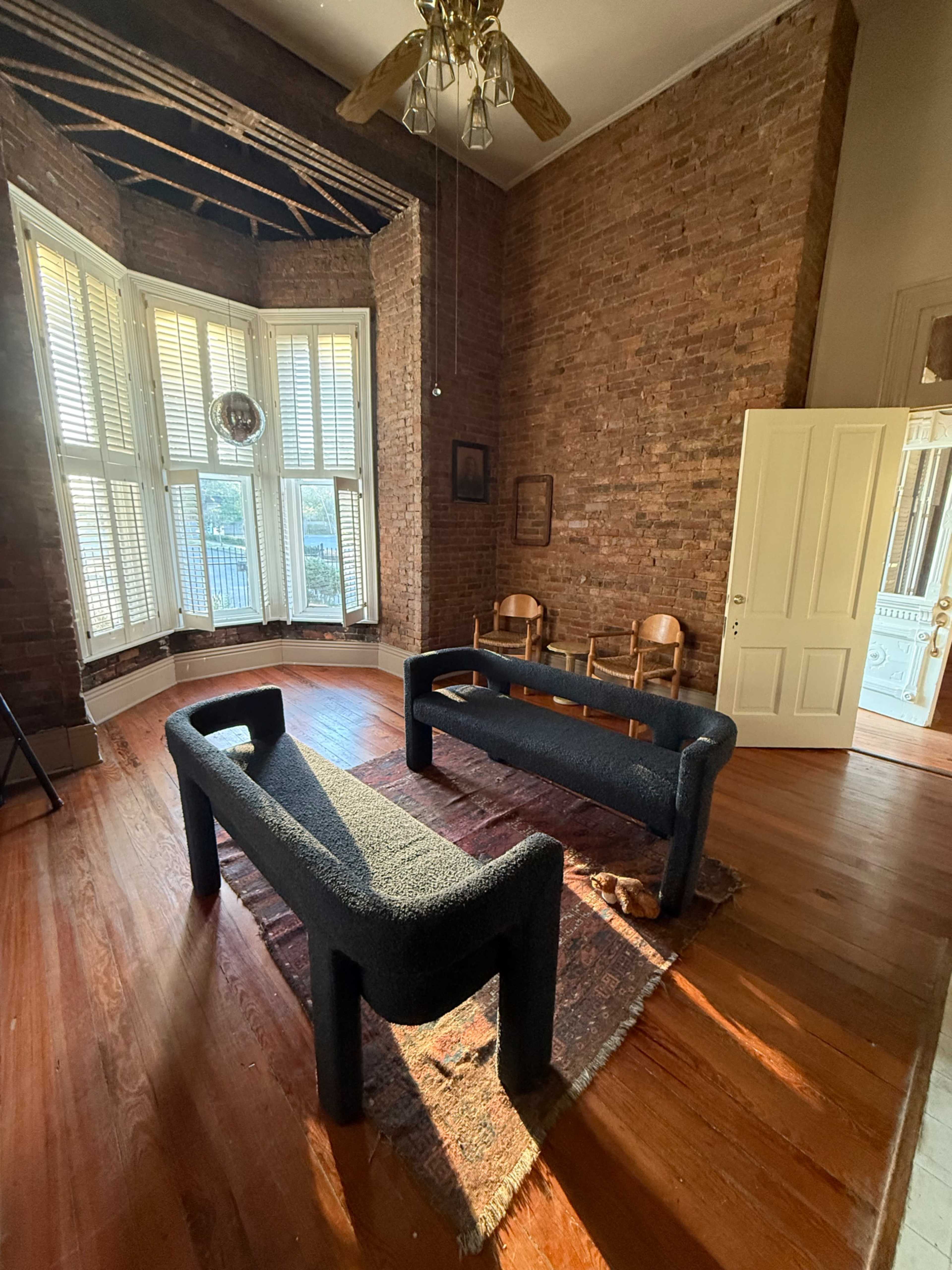 Brick Victorian with wrap around porch and exposed brick interior. Image in East Nashville, Nashville, TN