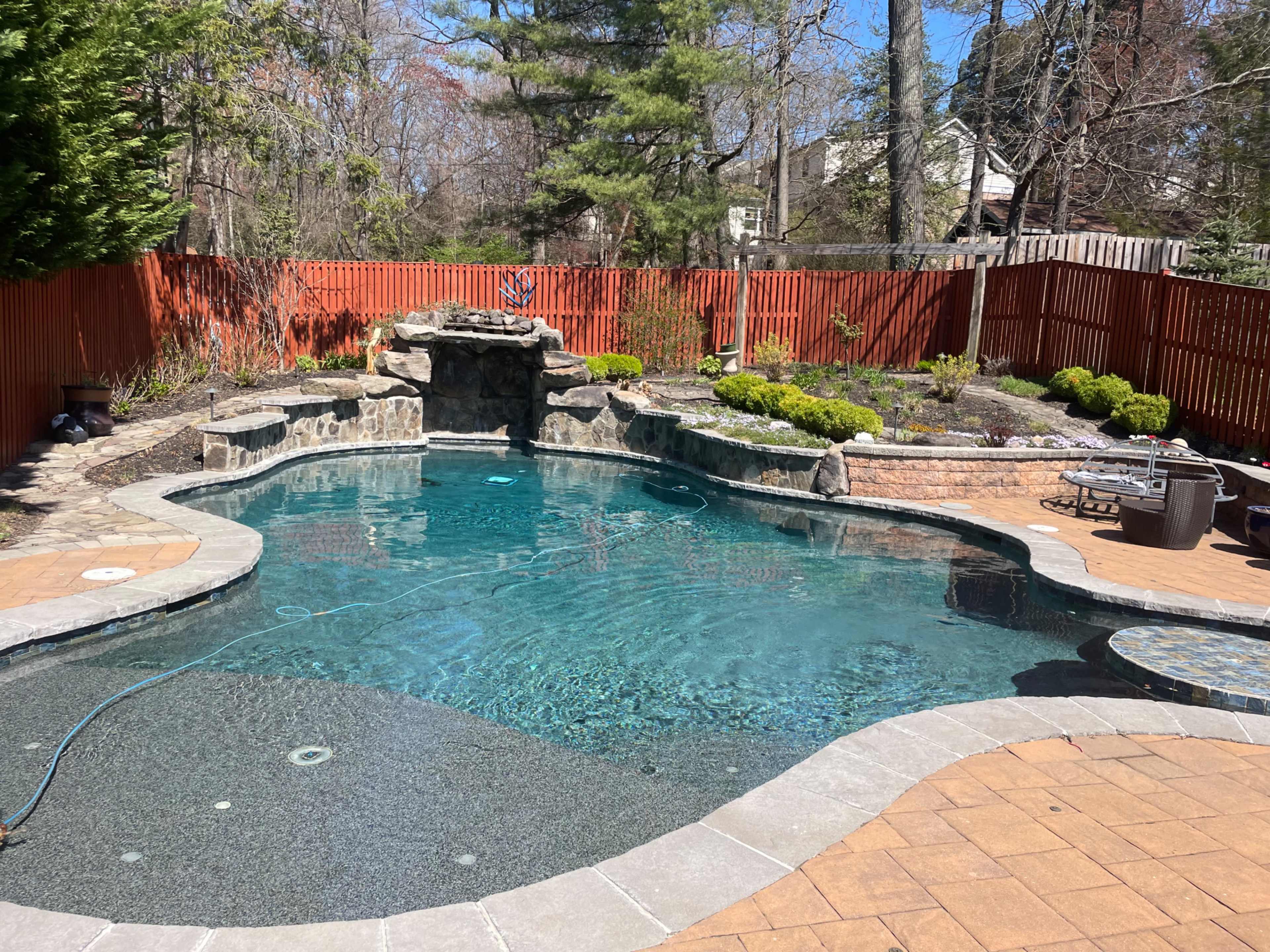 Pool with grotto surrounded by  tropical gardens Image in Savage, Savage, MD