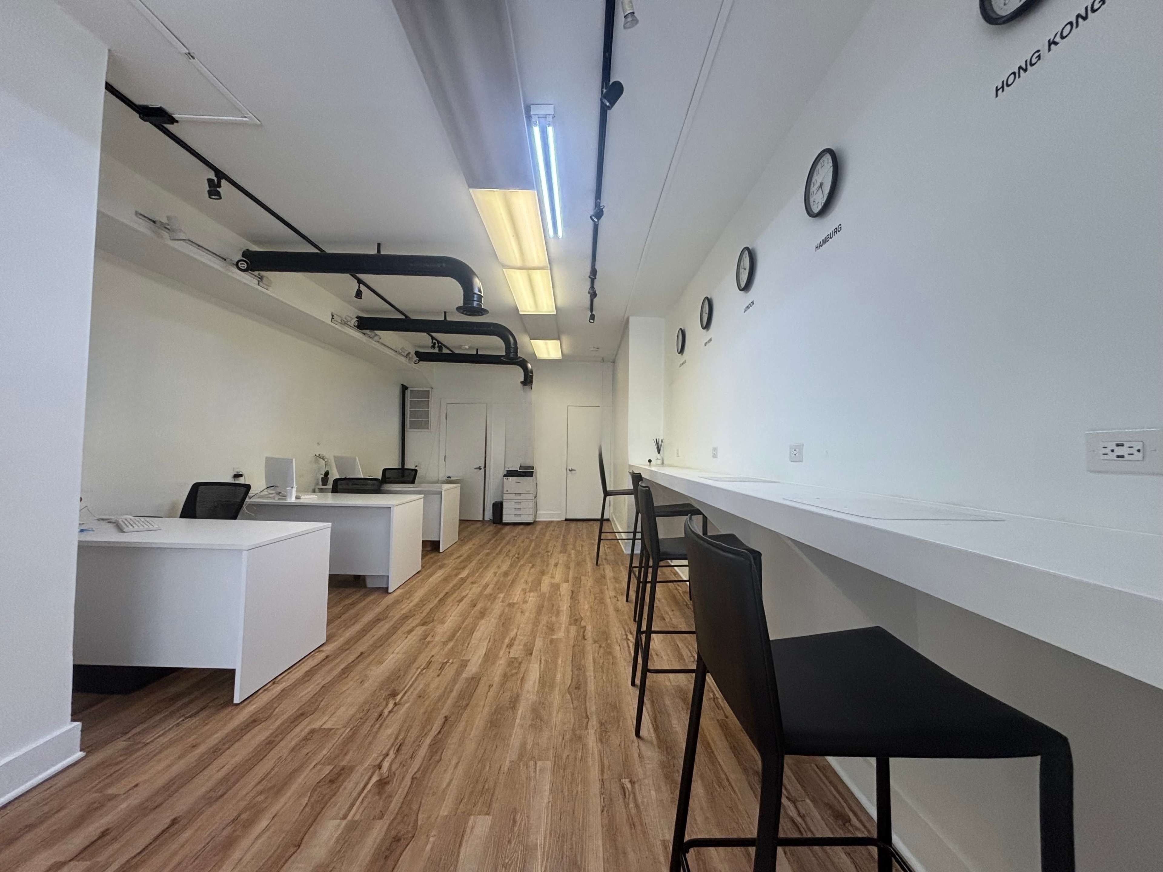 Crisp clean office space available for meetings, podcasts, photo shoots, and very small events. Image in Harsimus Cove, Jersey City, NJ