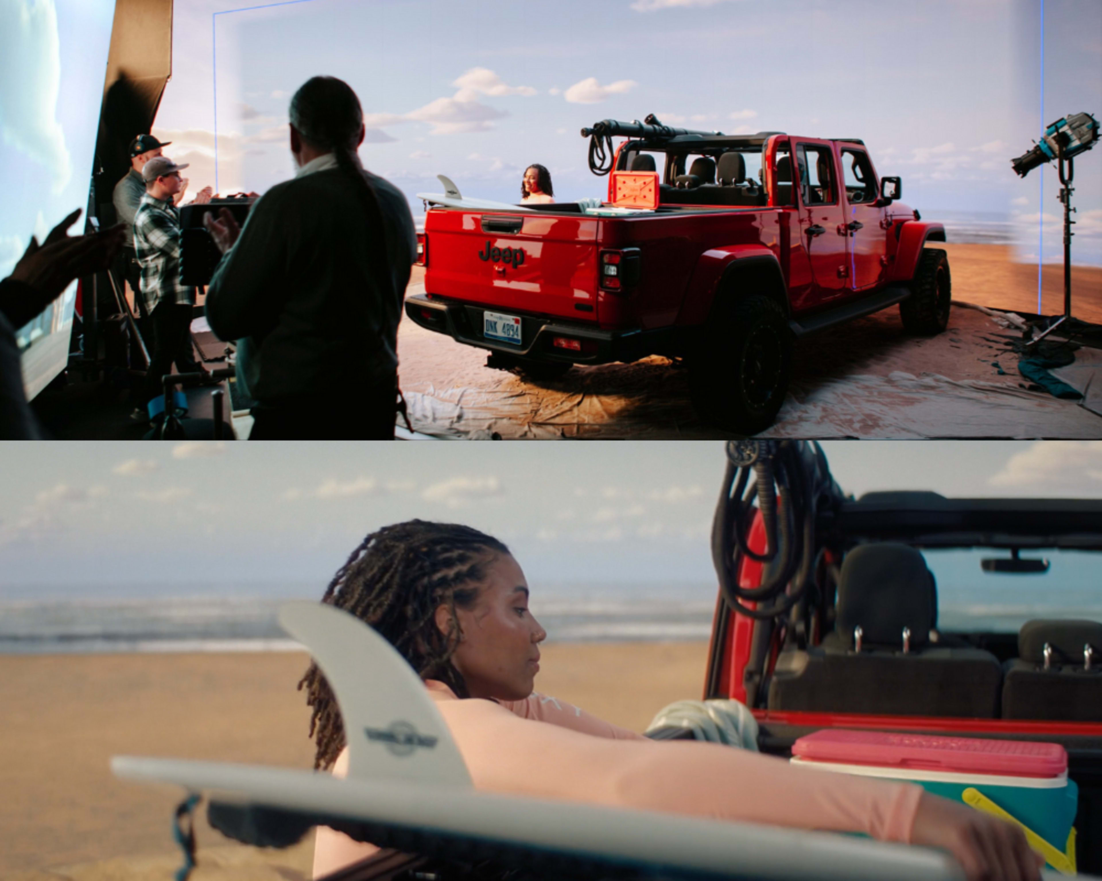 A red Jeep Gladiator is parked on a sandy beach set, while a woman lies in the back with a surfboard and beach gear.