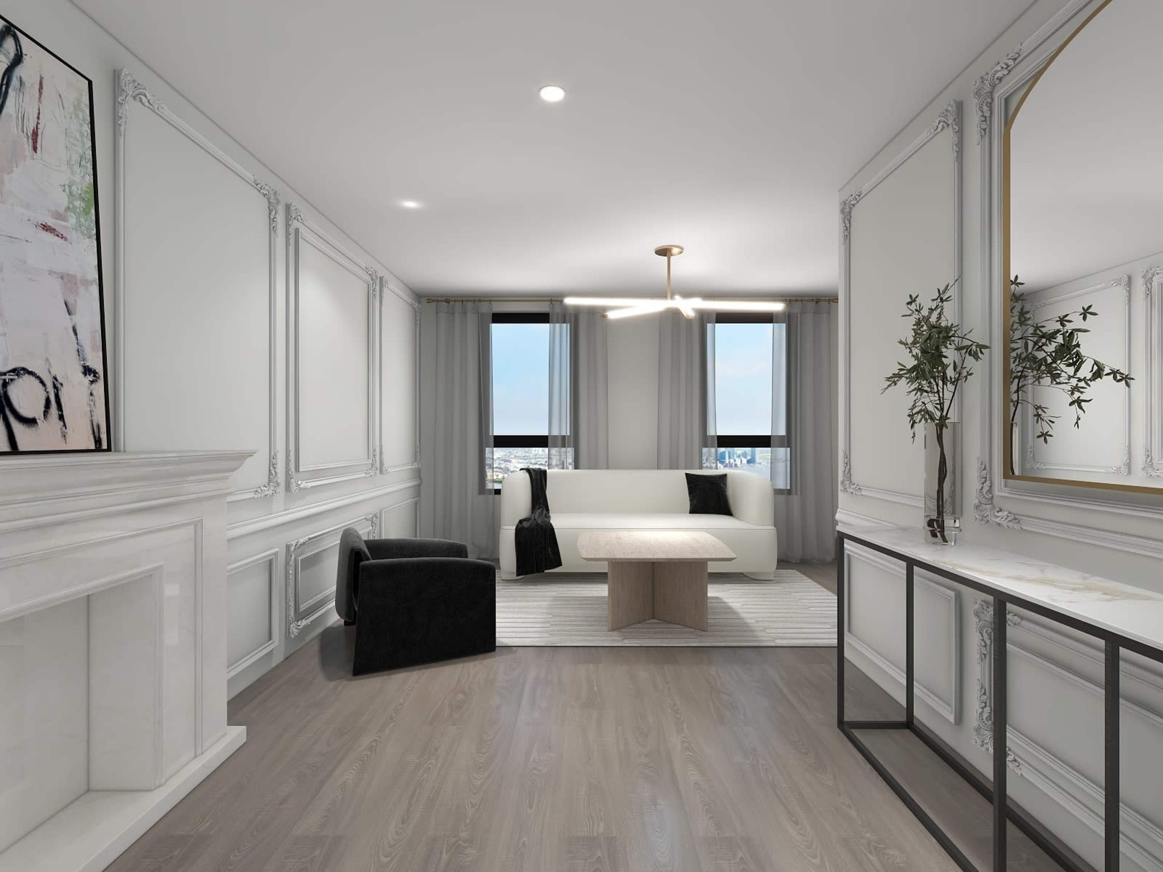 A modern living room with a white sofa, a black accent chair, a marble fireplace, and large windows, adorned with decorative molding and a mirror.