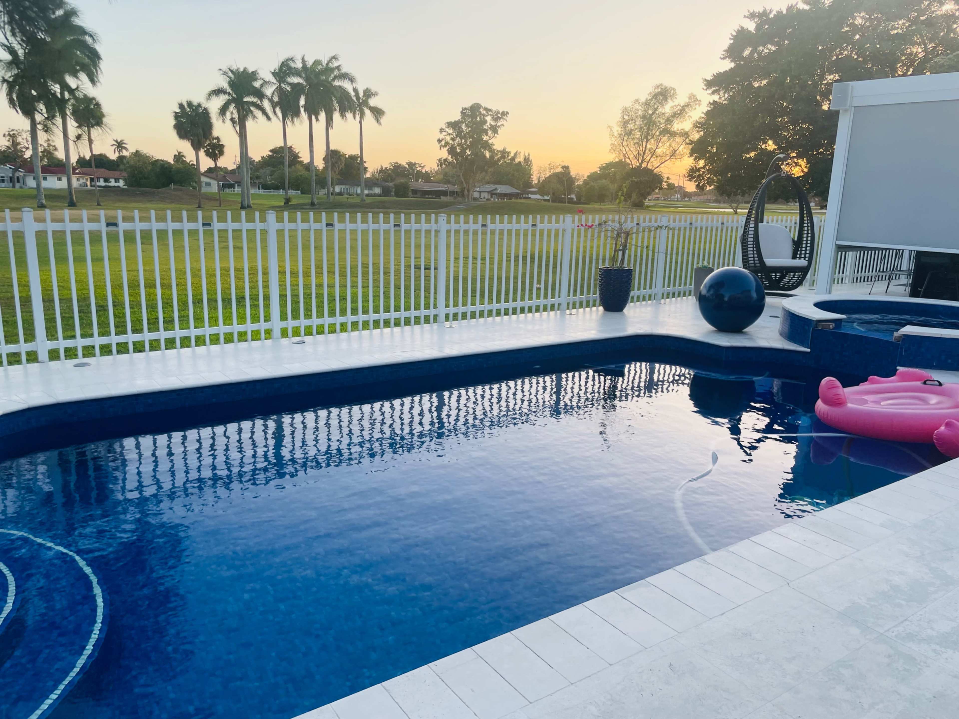 Country club, suburban, outdoor area with pool. Golf course view, roomy area with plenty of seating. Image in Country Club, Miami, FL