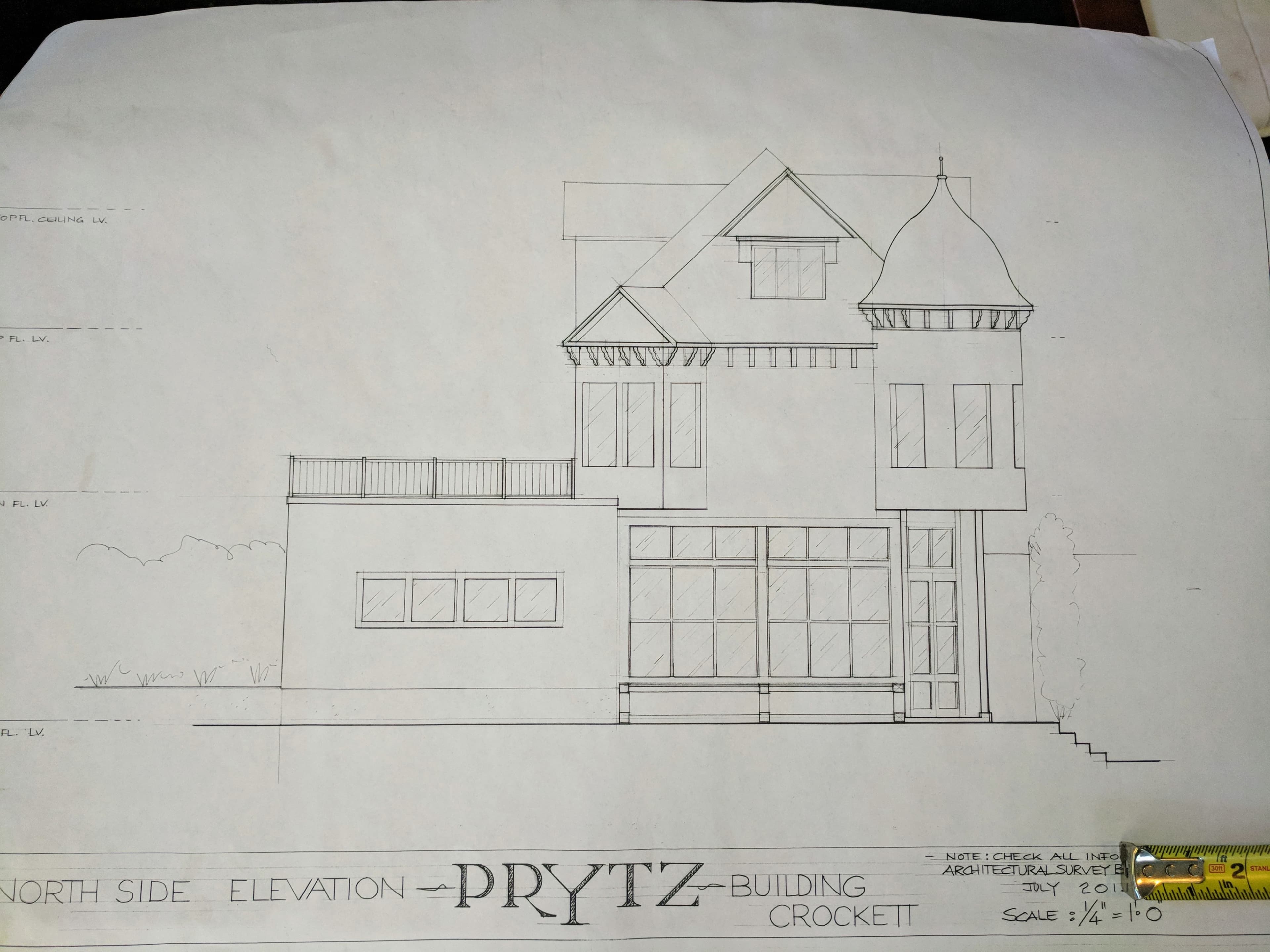 A detailed architectural elevation drawing of a building labeled "PRYTZ" with a distinct structure featuring a turret and balconies.