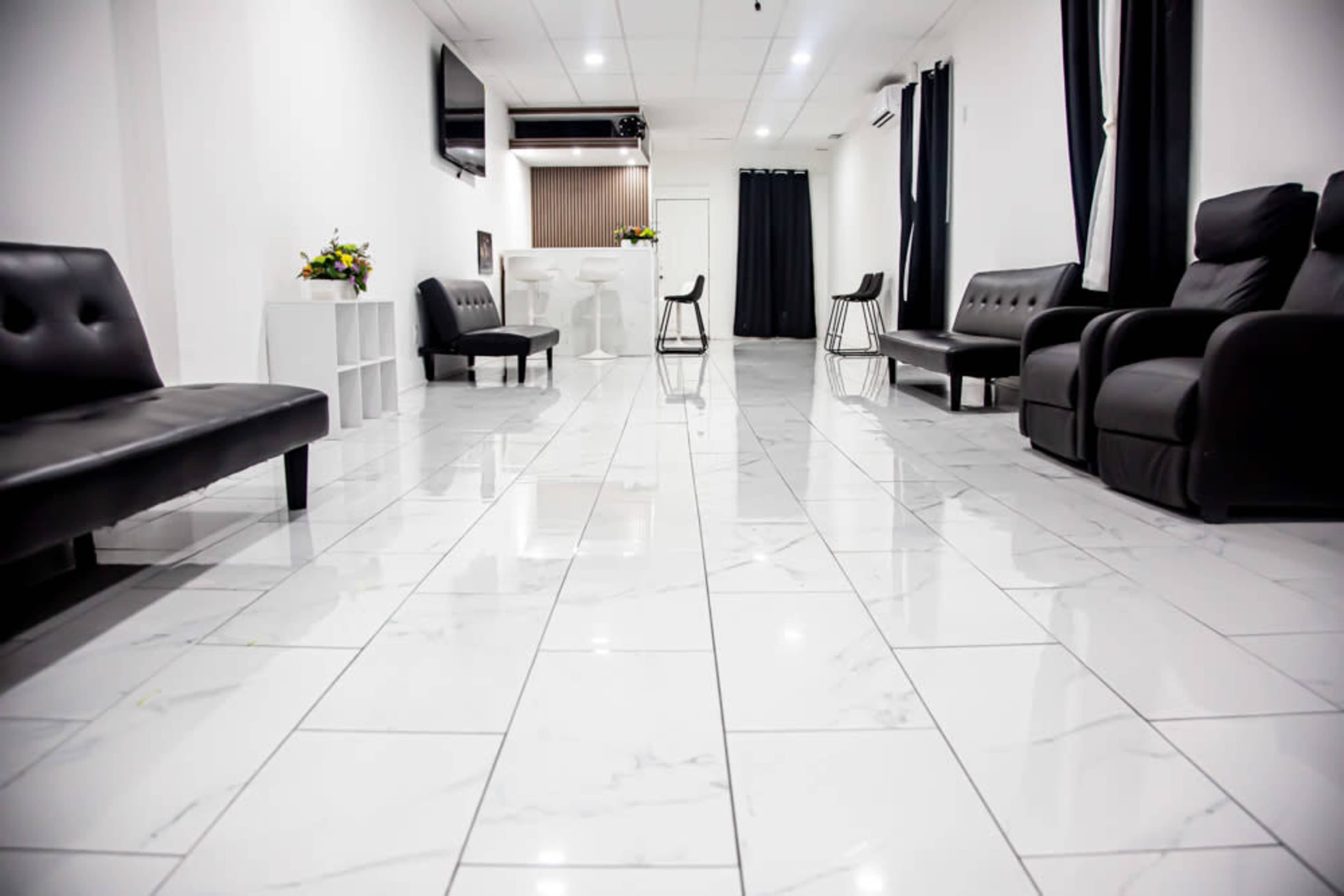 Elegant Black & White Space with Marble Floors and a Wood-Finished Bar Image in Hempstead, Baldwin, NY