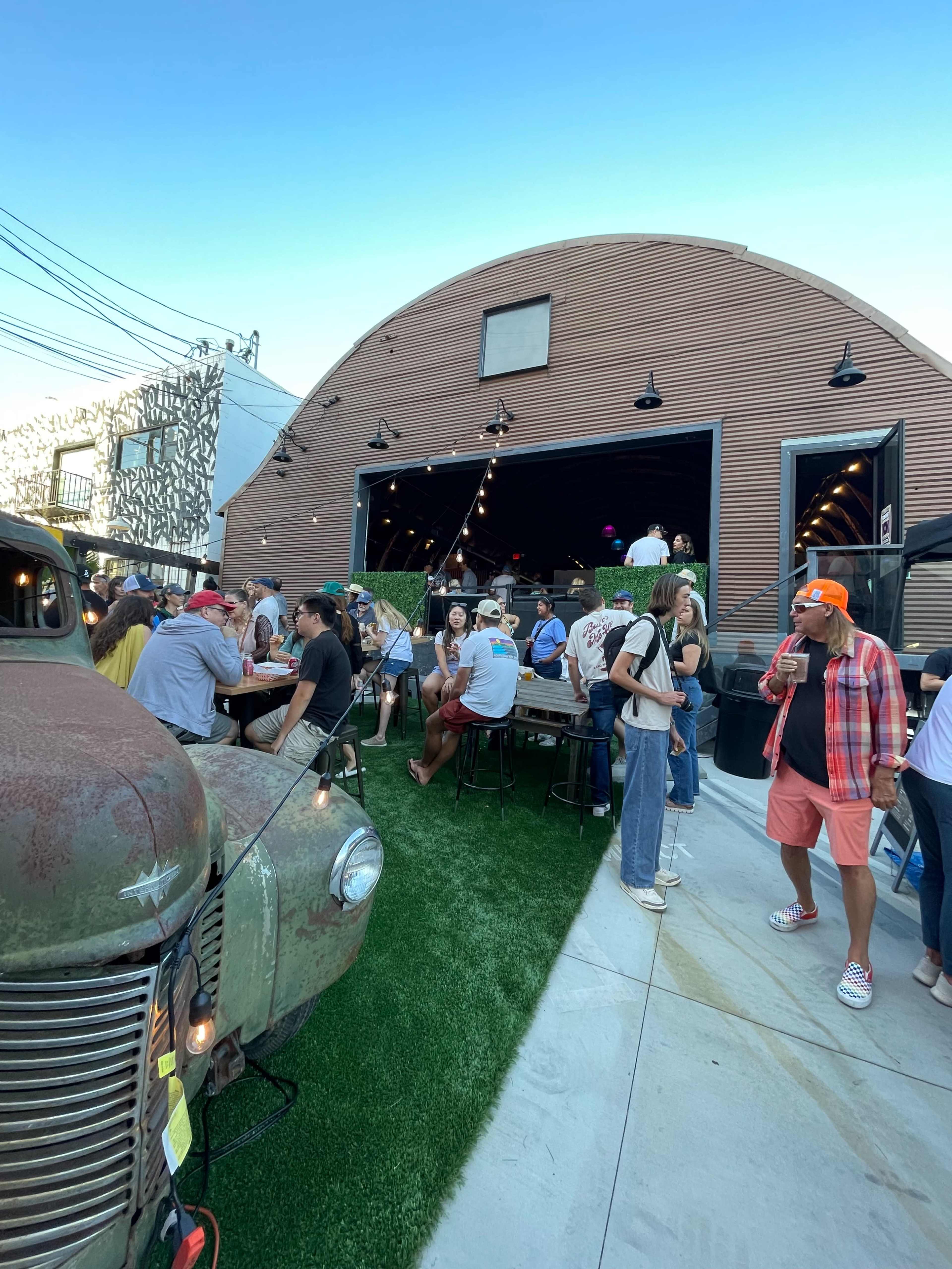 Short throw from Main Street El Segundo with retrofit original quonset hut with tall ceilings, nice industrial steampunk feel softened with warm wood furniture. Image in El Segundo, El Segundo, CA