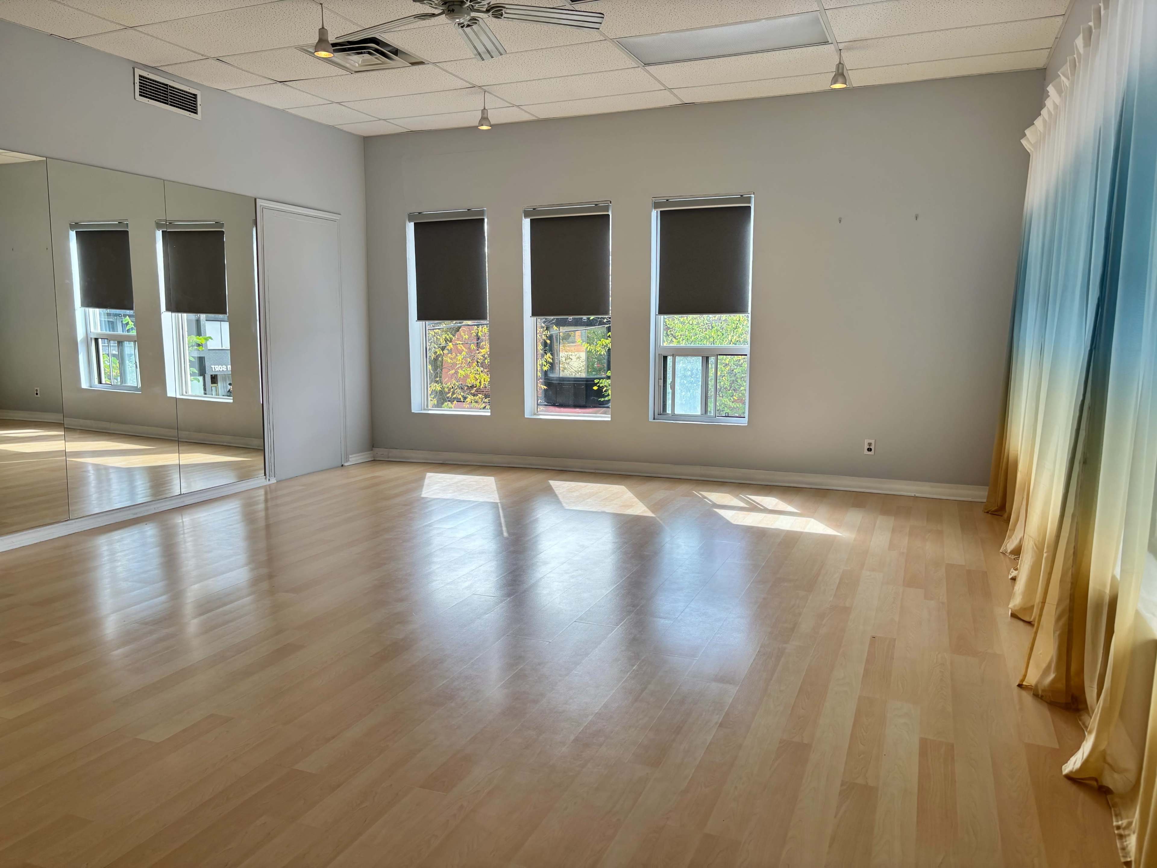 Sunny Dance & Yoga Studio with Ombré Curtains | Natural Light Haven Image in Harbord Village, Toronto, ON