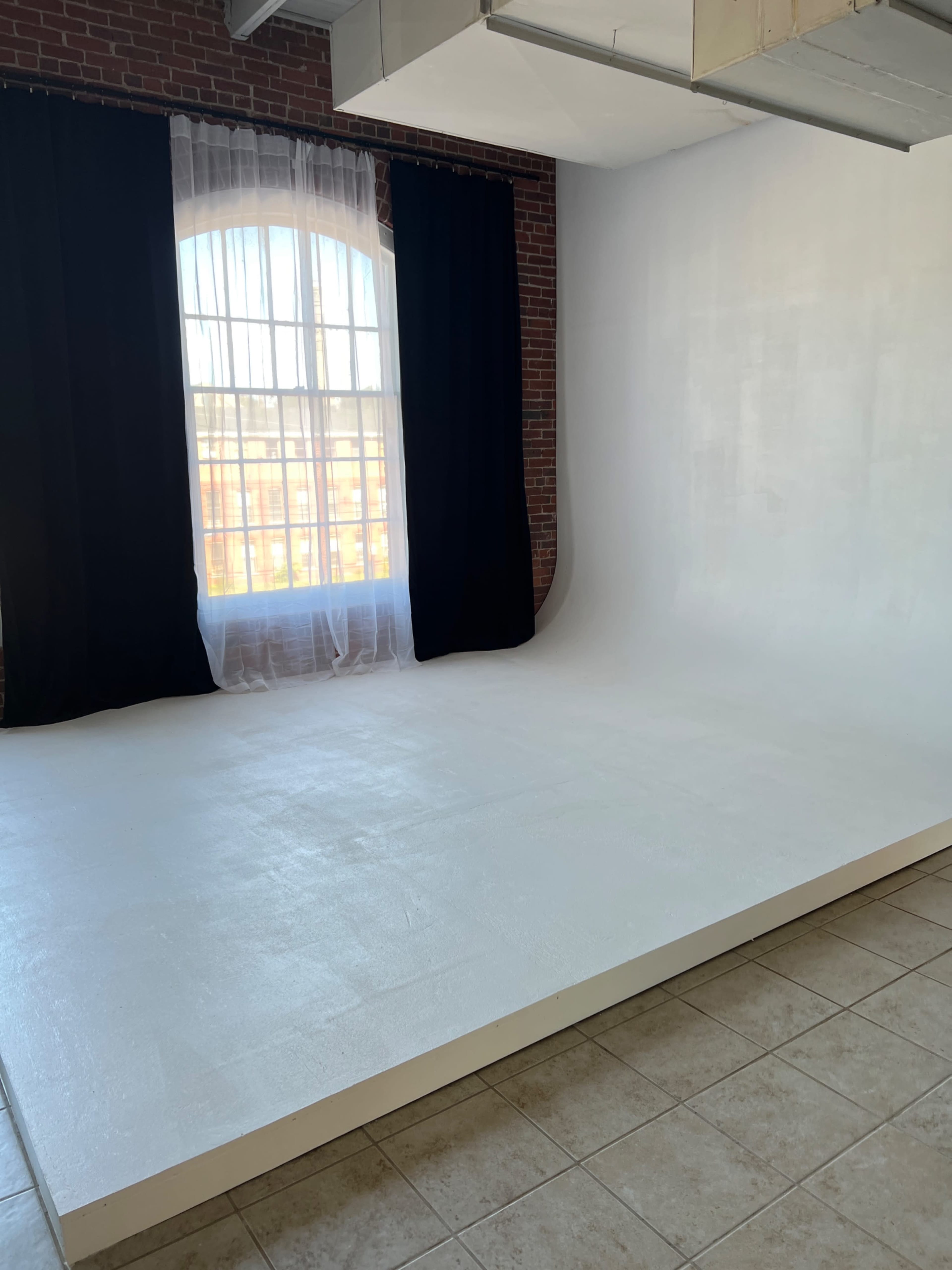 Natural Light Photography Studio with Exposed Brick Image in Lawrence, Lawrence, MA