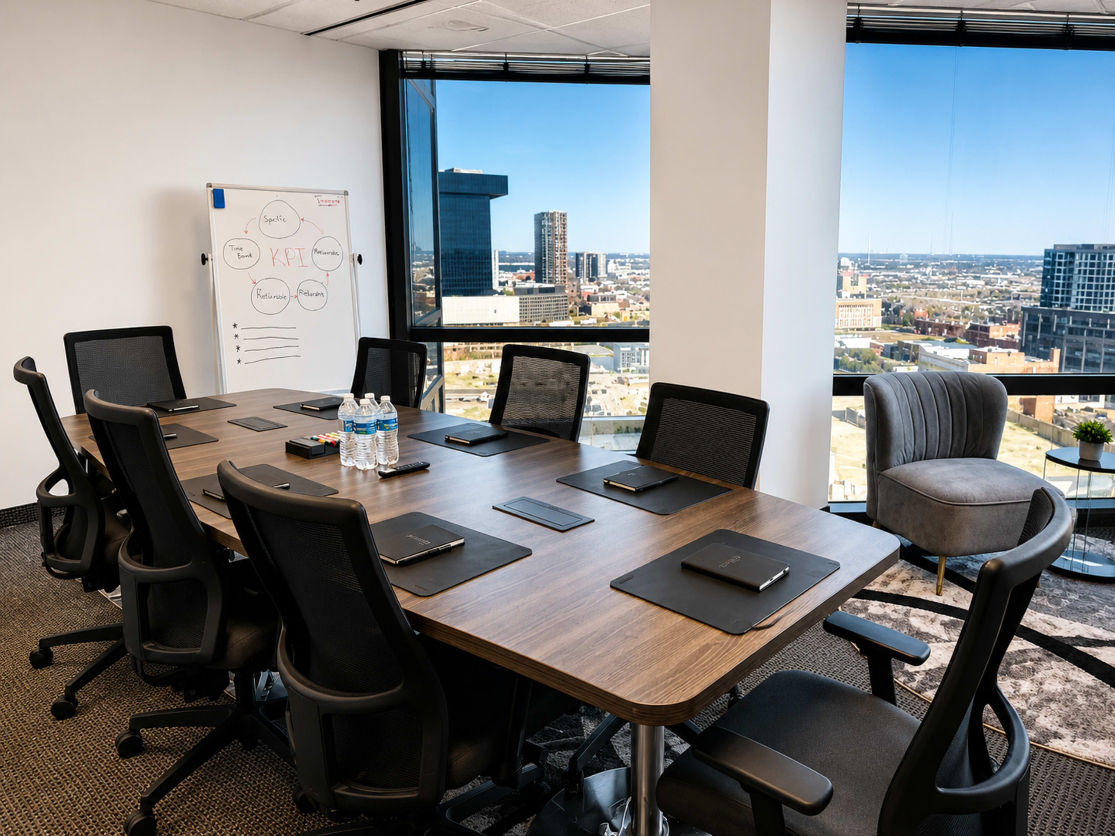 The image shows a modern conference room with a large table, eight chairs, a whiteboard, and a view of the city skyline through large windows.