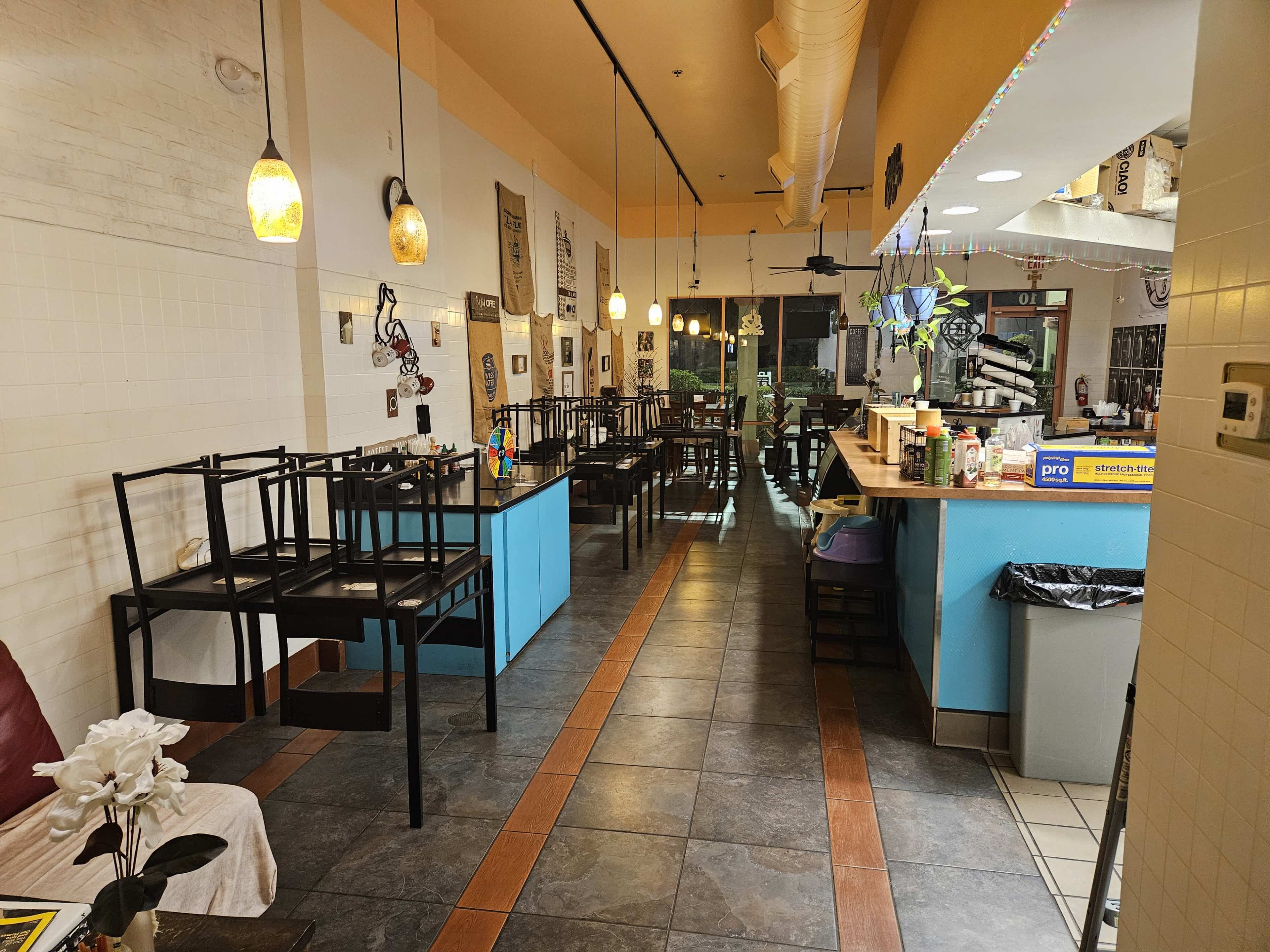 Charming Café Gathering Space with Warm and Inviting Interior Image in Town Of Blake, South Daytona, FL