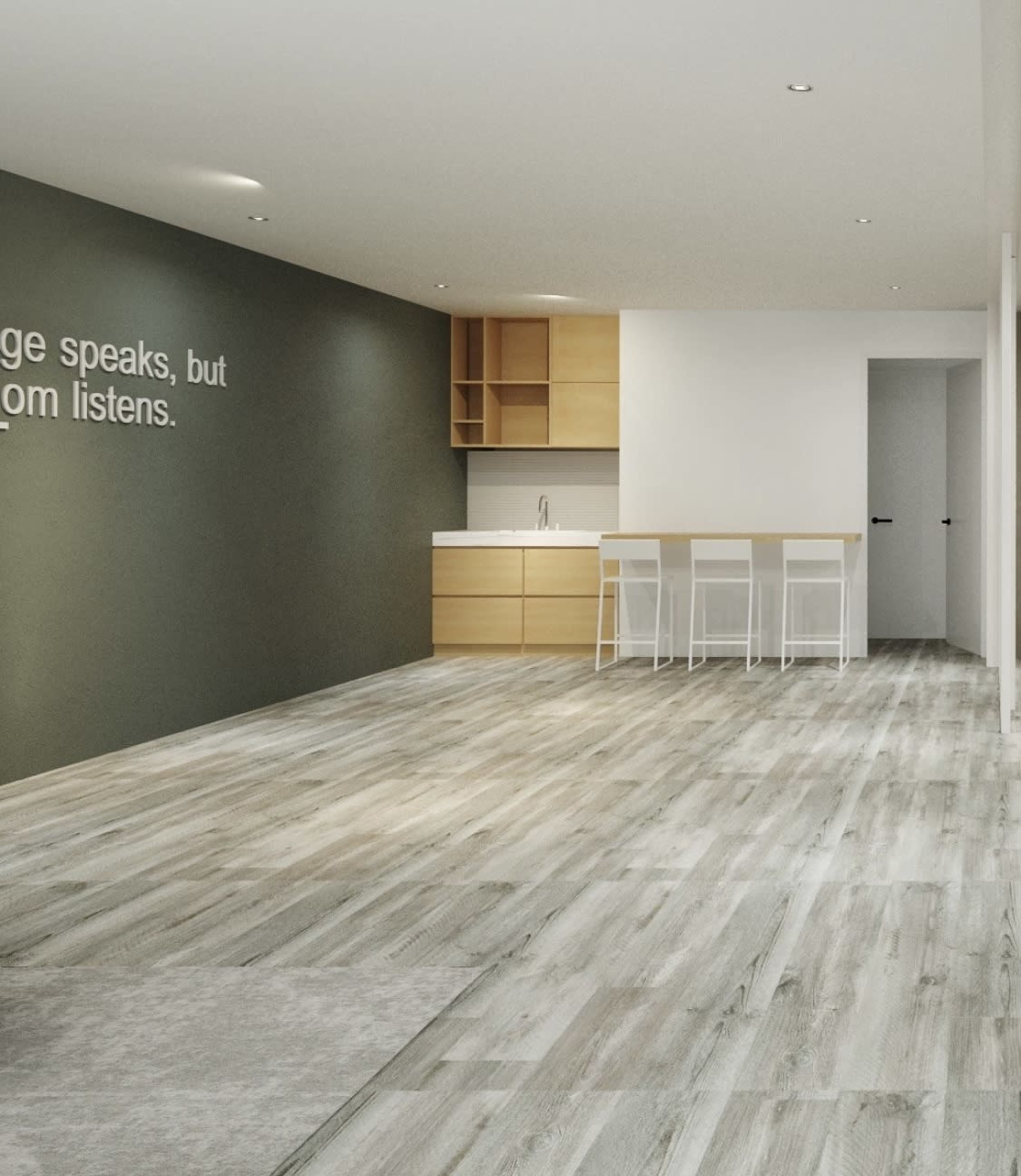 A modern, open-concept kitchen and dining area with light-colored wooden flooring and minimalist furniture.