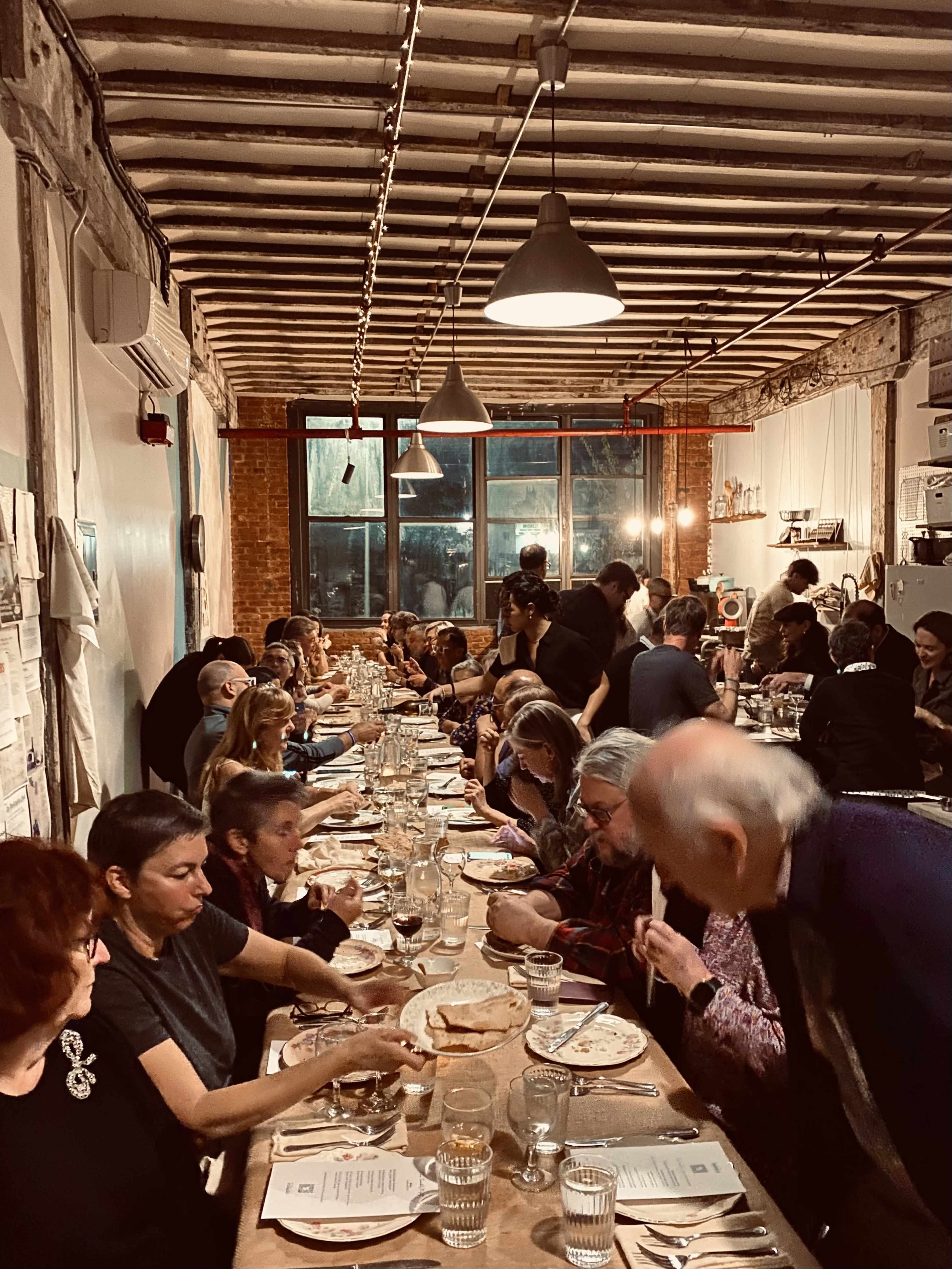 Industrial Brooklyn kitchen studio loft great for cooking classes, events, private dinners, video shoots in renovated warehouse with amazing natural light, old wood beams, exposed brick, high ceilings, full chef's kitchen, vintage gas stove Image in Sunset Park, Brooklyn, NY