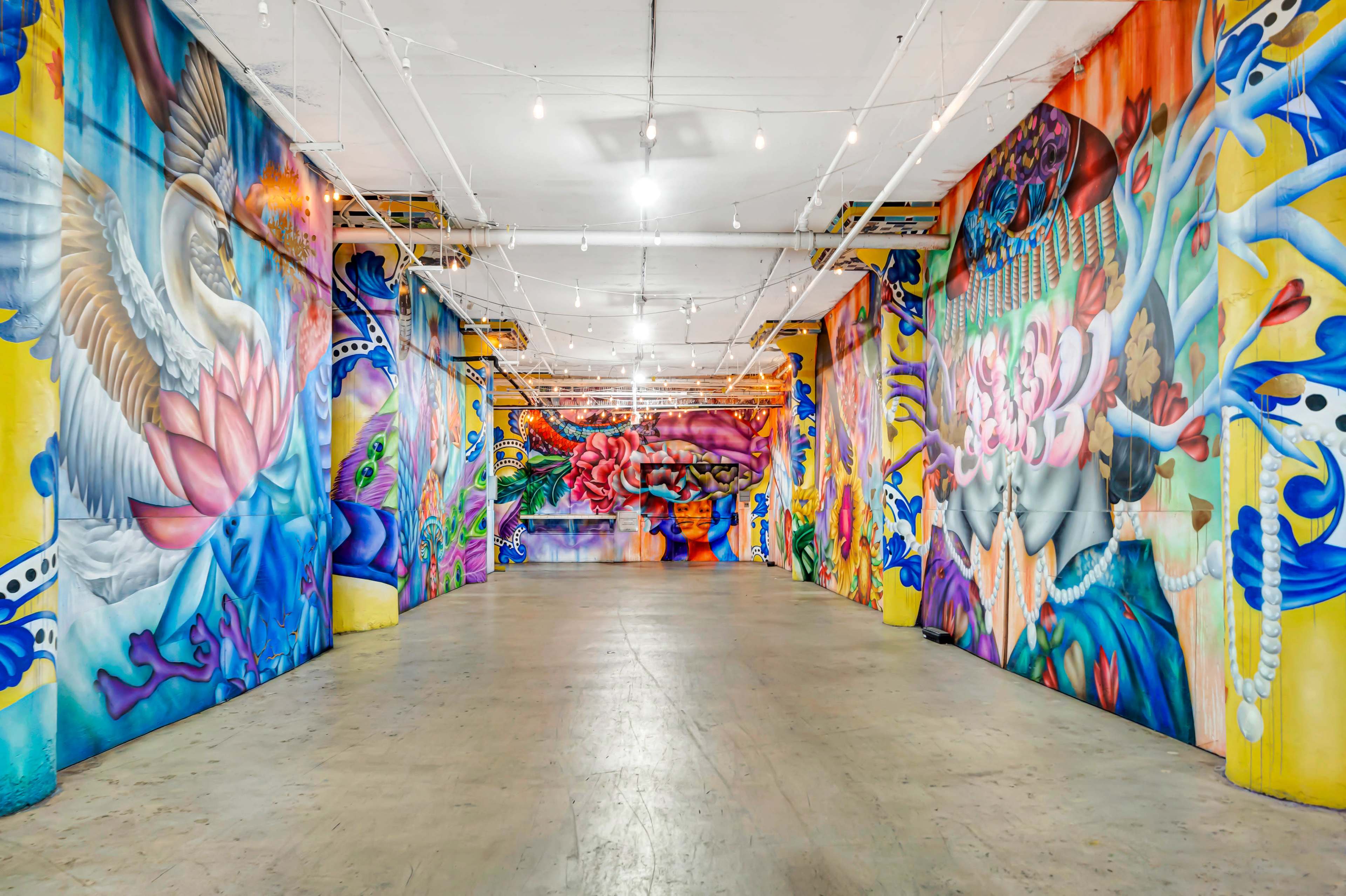 Immersive Industrial Corridor with Vibrant Floor-to-Ceiling Murals Image in Central LA, Los Angeles, CA