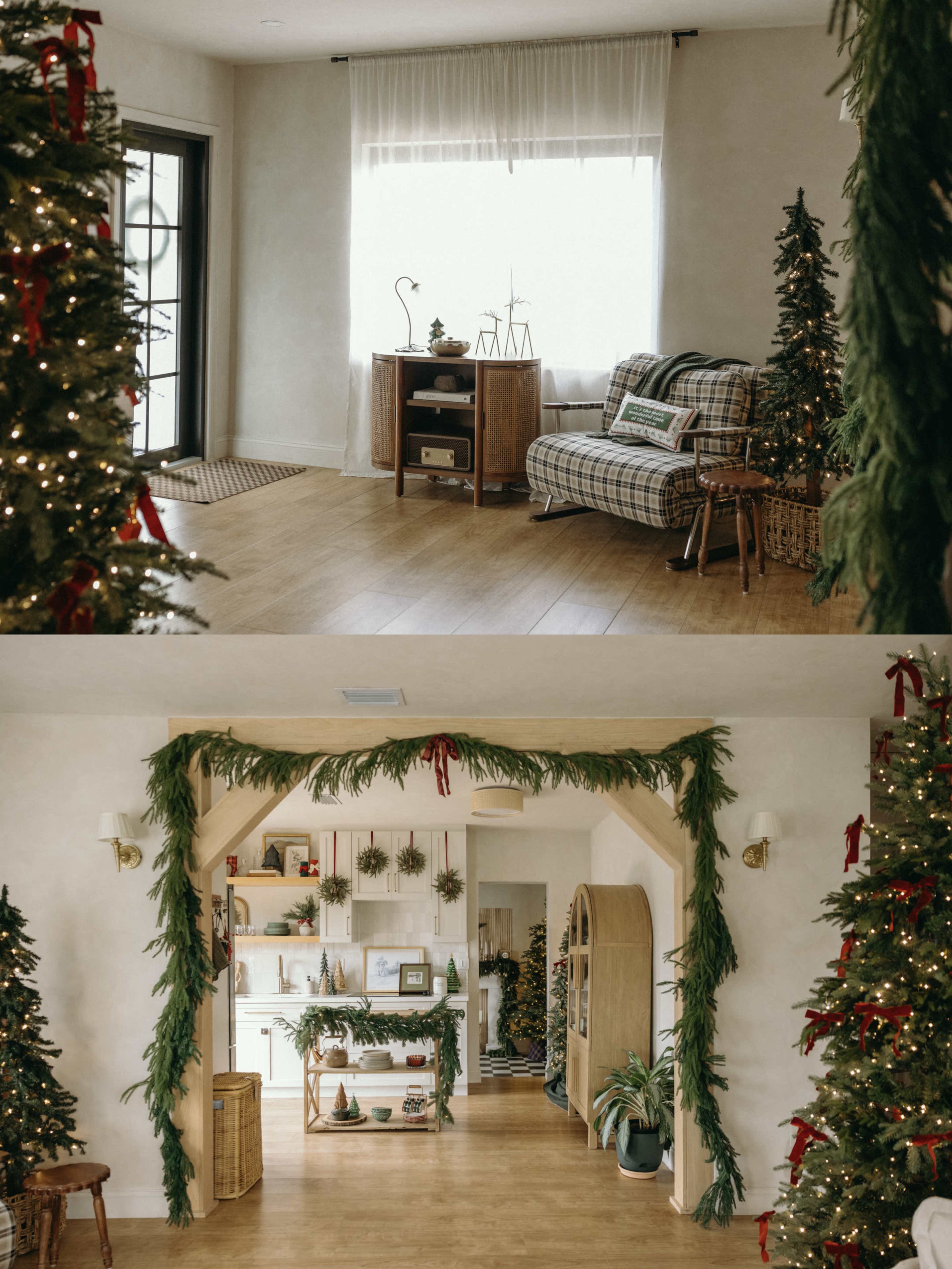 The image shows a cozy room decorated for the holidays, featuring a living area with a couch, a Christmas tree, and a hallway adorned with greenery and festive decorations.