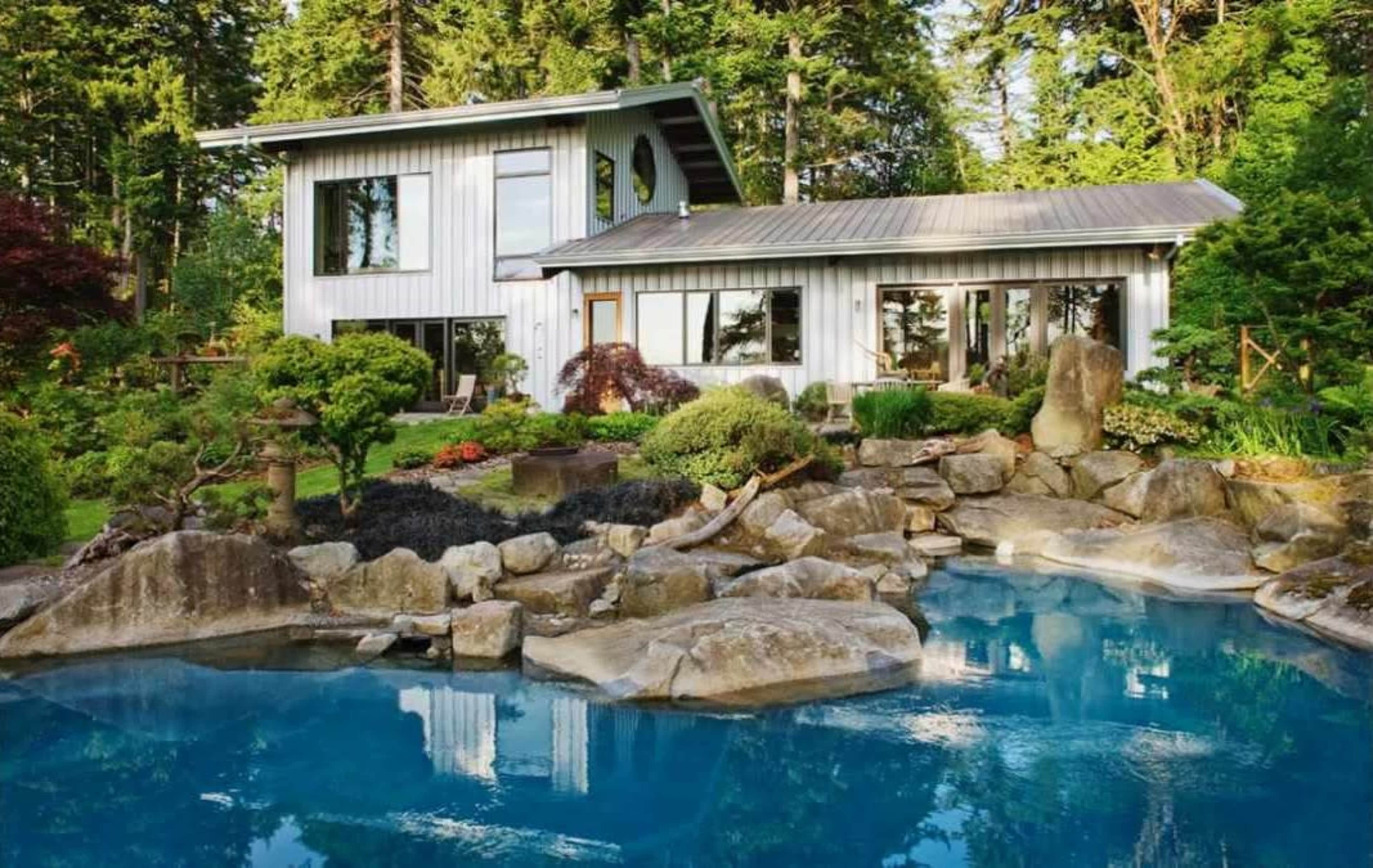 Wooded retreat space with a spacious house, open kitchen, a plunge pool and view of the Puget Sound Image in Vashon, VASHON, WA