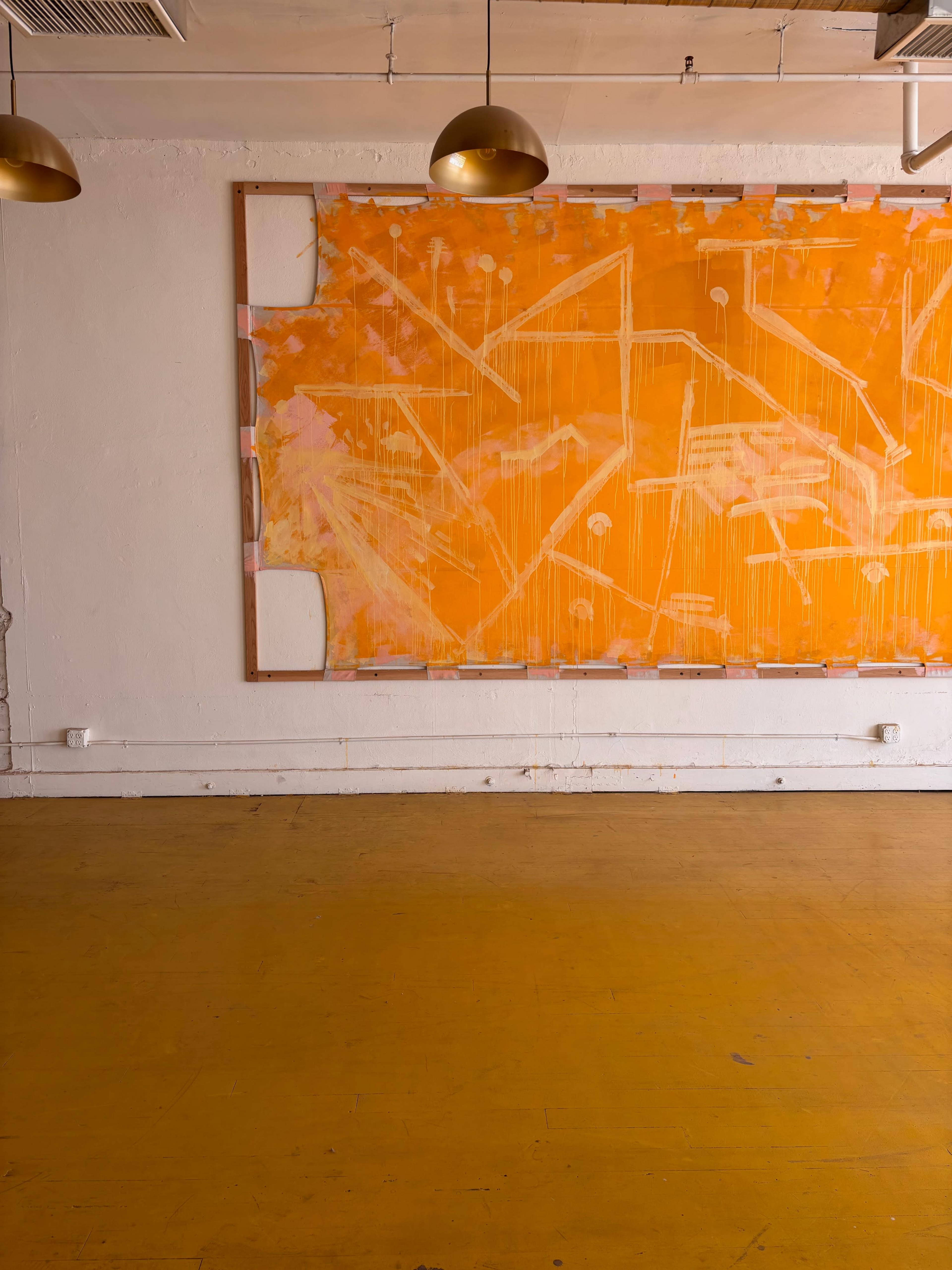 The image shows an empty room with a large orange abstract painting mounted on a white wall, and a yellow floor.