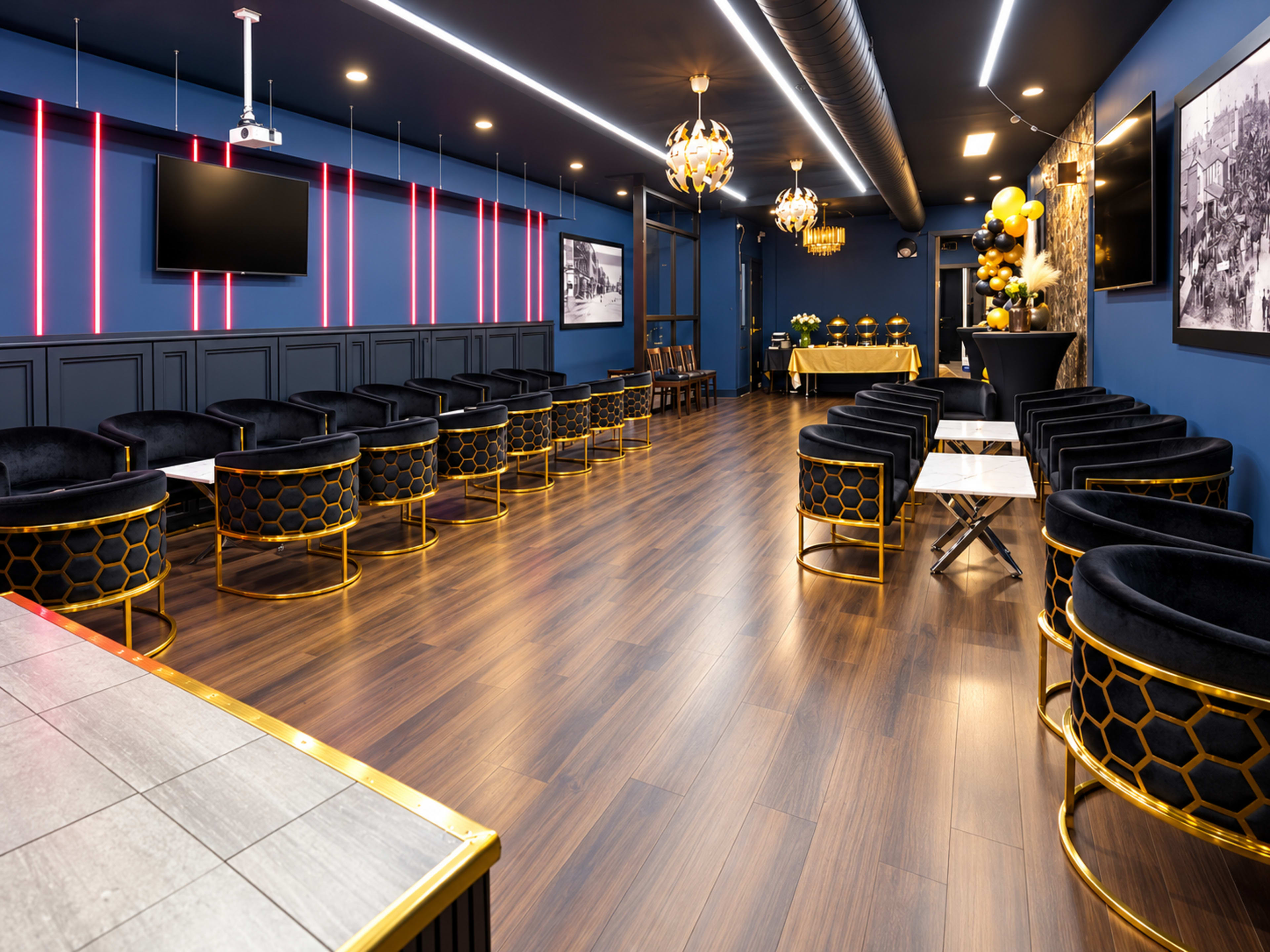 The image shows a stylish interior room featuring black and gold circular seating, a long bar area, and decorative lighting.