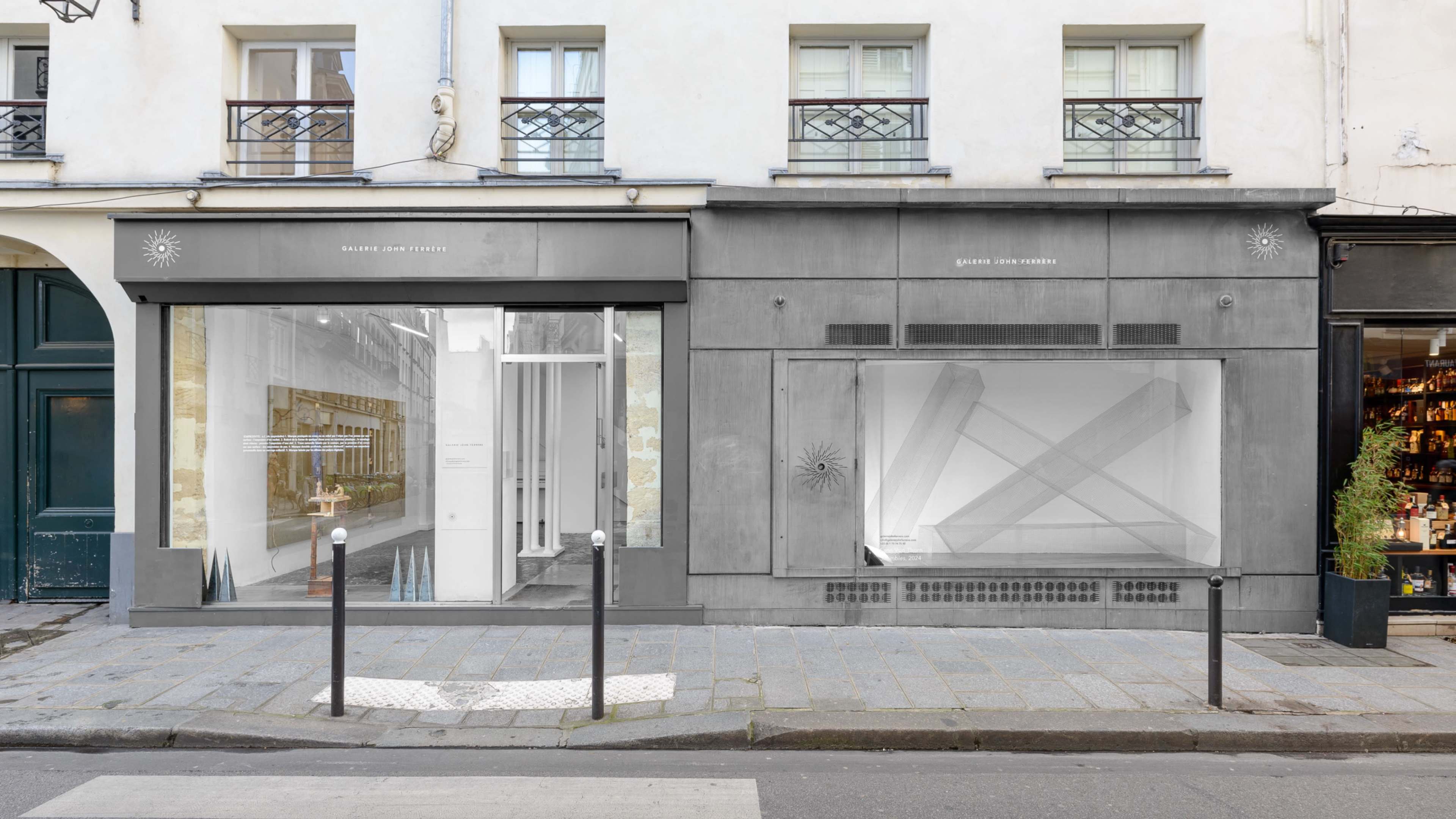 The image shows a storefront with a modern design featuring large glass windows on a street in Paris, showcasing a minimalist display inside.