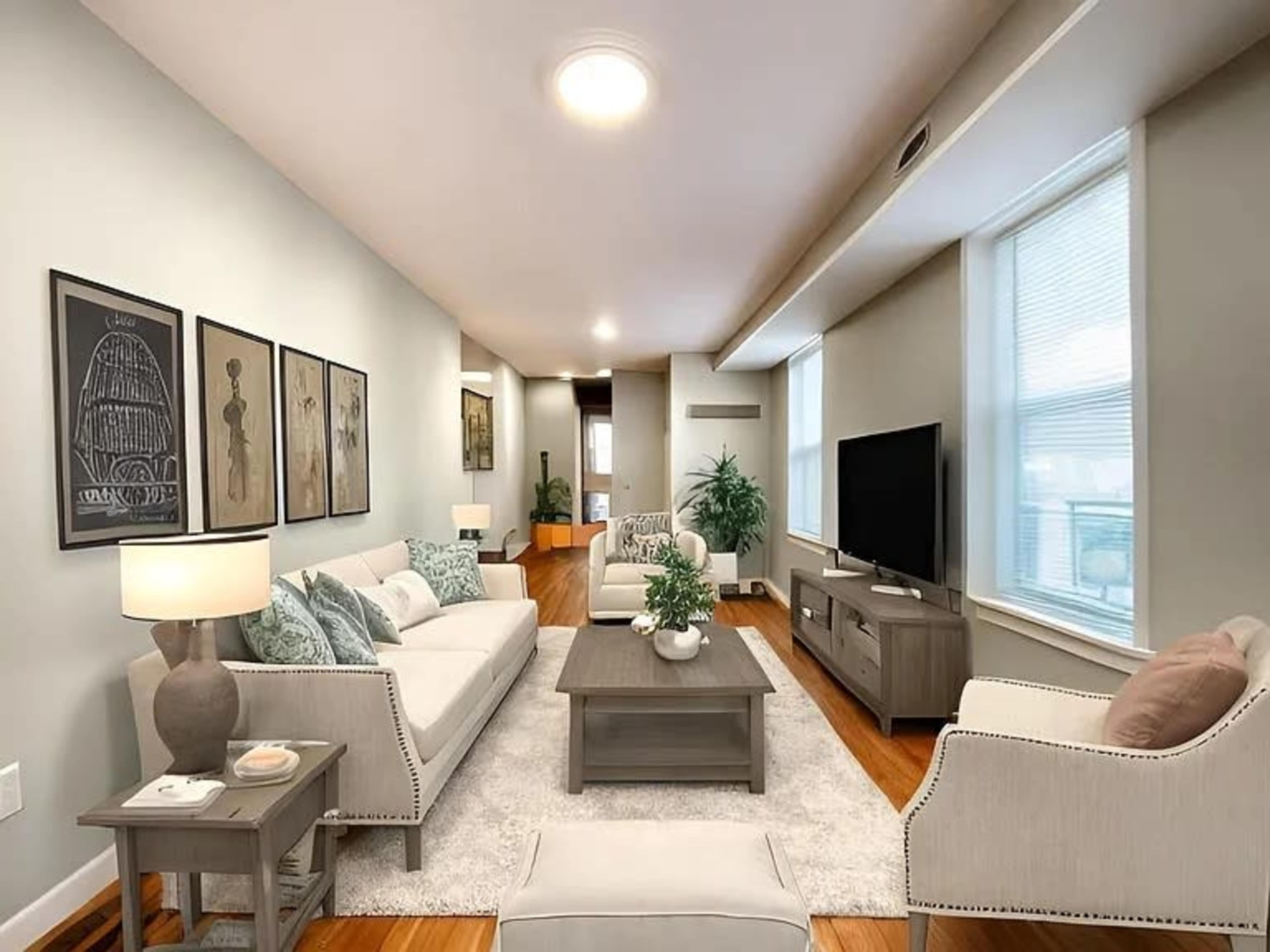 The image shows a modern living room with a beige color scheme, featuring a sofa set, a coffee table, and a television against a light gray wall.