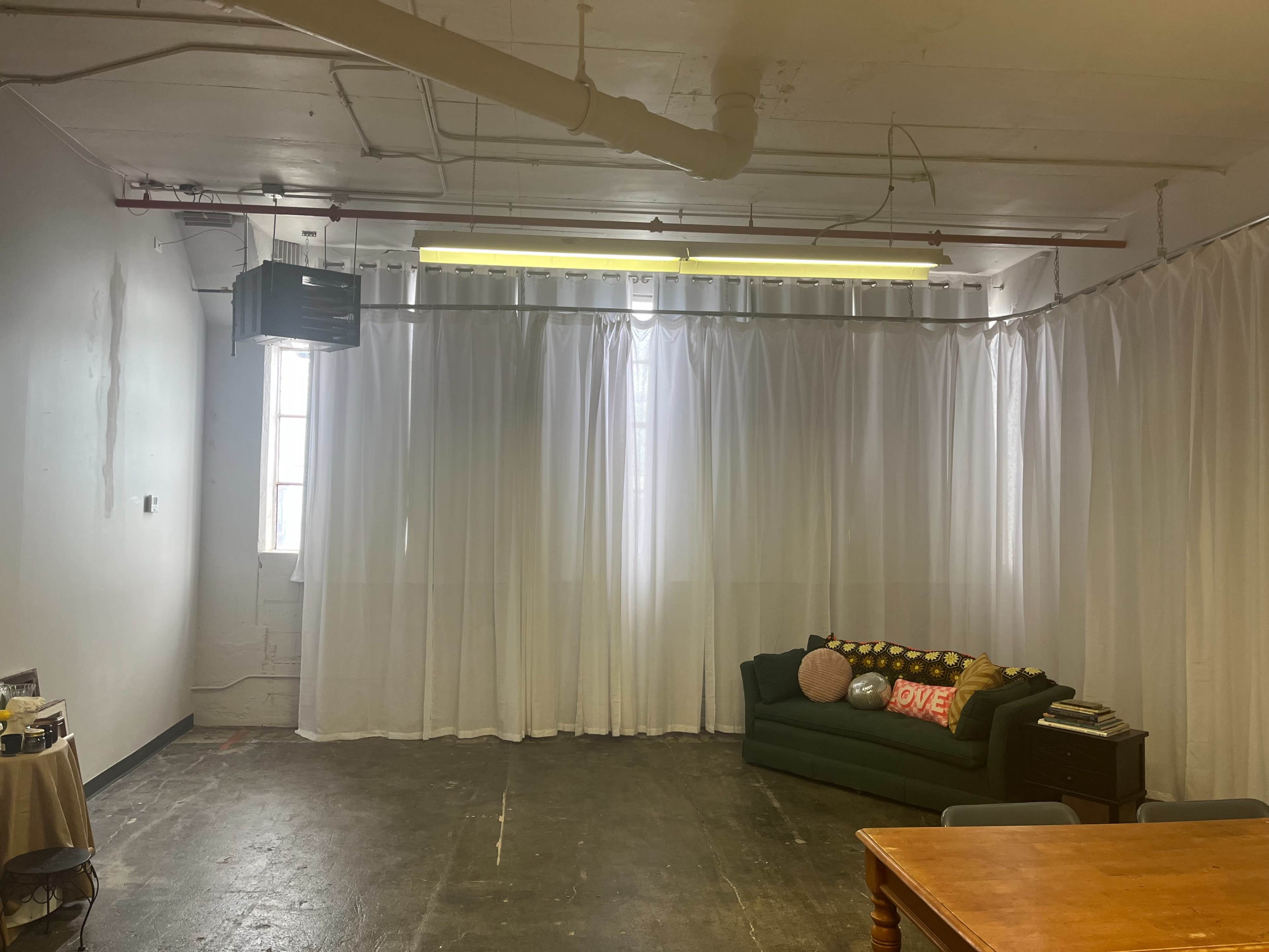 Natural Light-Filled Warehouse Studio with Harbor Skyline View Image in Bay View, Milwaukee, WI