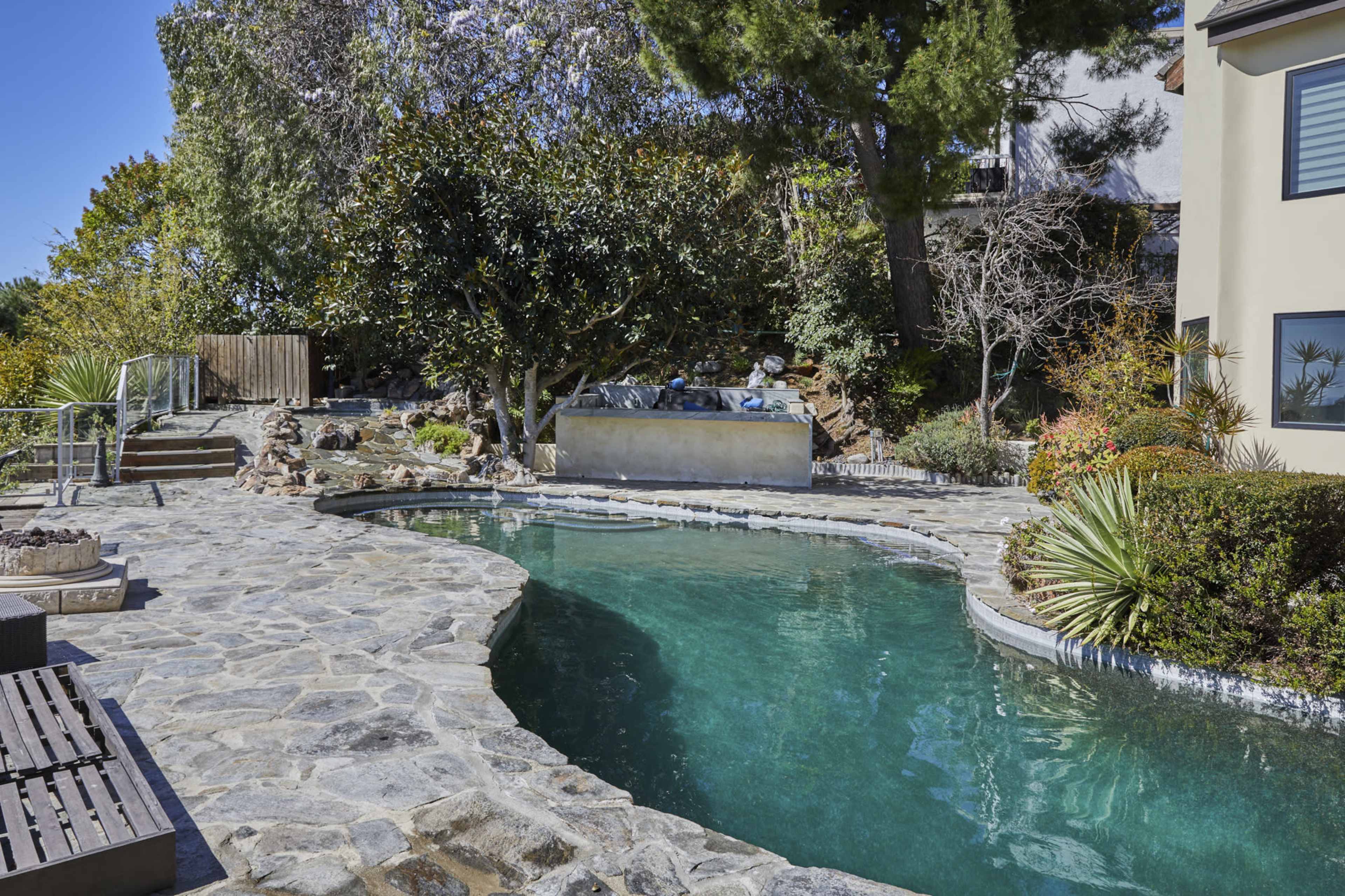 Stunning Bel Air mansion offering breathtaking views of West Los Angeles, rolling hills, majestic mountains, lush greenery, and the sparkling Pacific Ocean Image in Beverly Crest, Los Angeles, CA