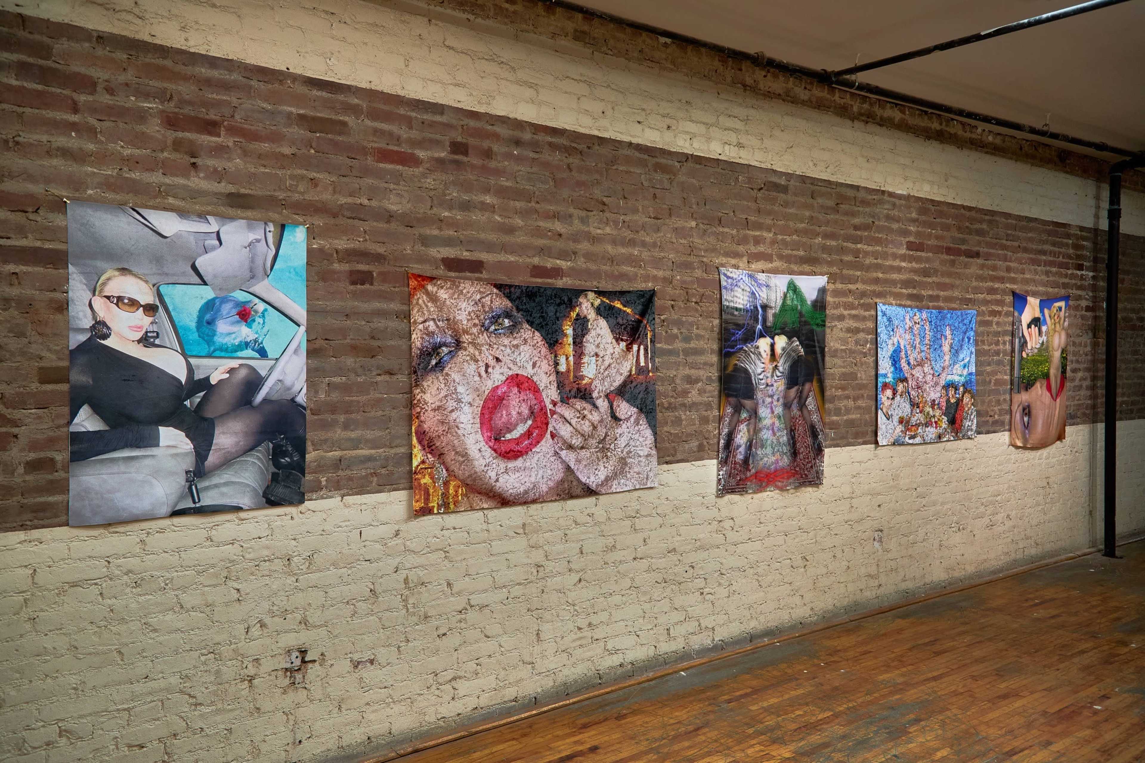 The image shows a gallery wall featuring five large art pieces displayed on a brick backdrop.