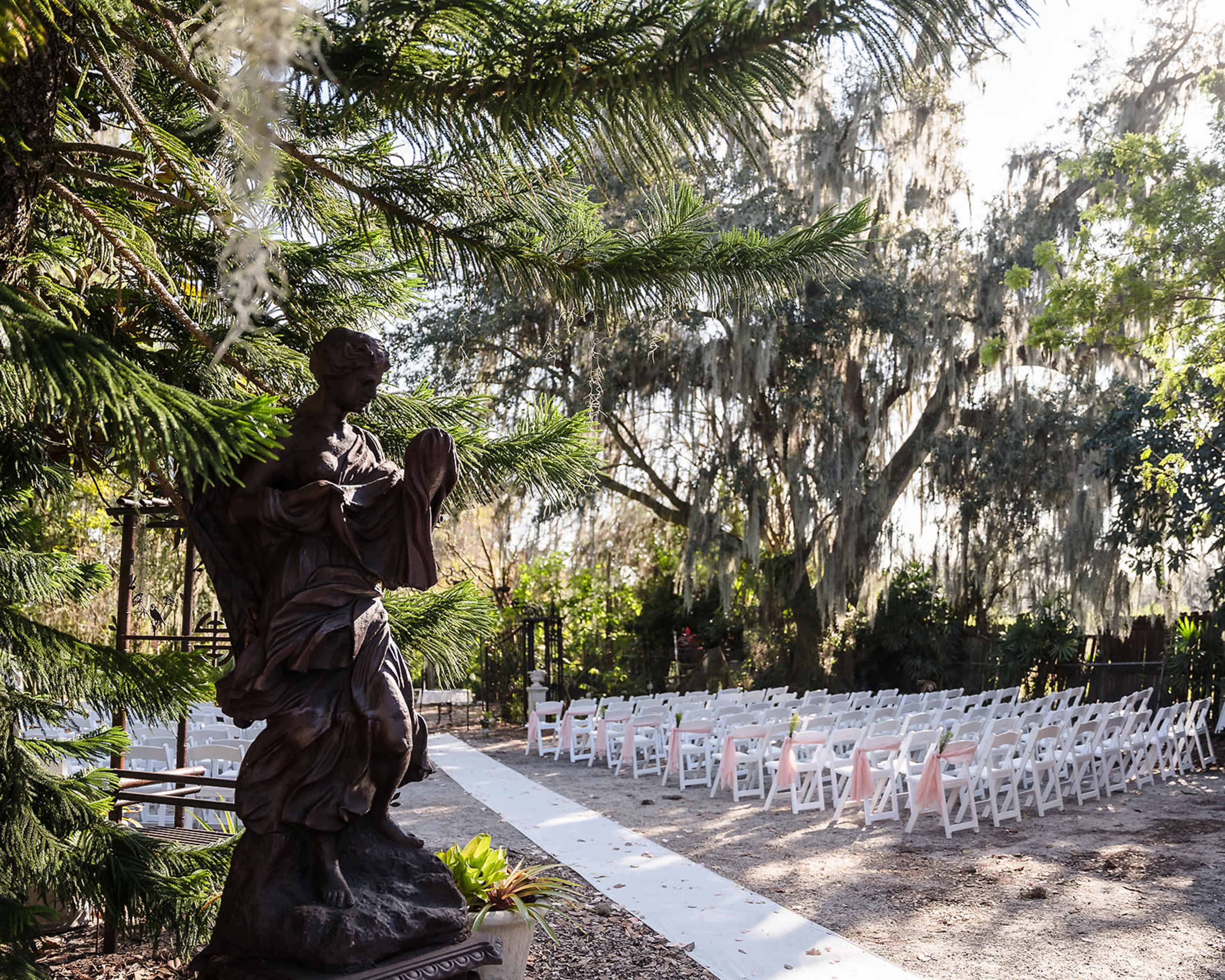 Whimsical Garden Venue with Greenhouse, Sculptures, and Meandering Pathways Image in East County Civic Group, Plant City, FL