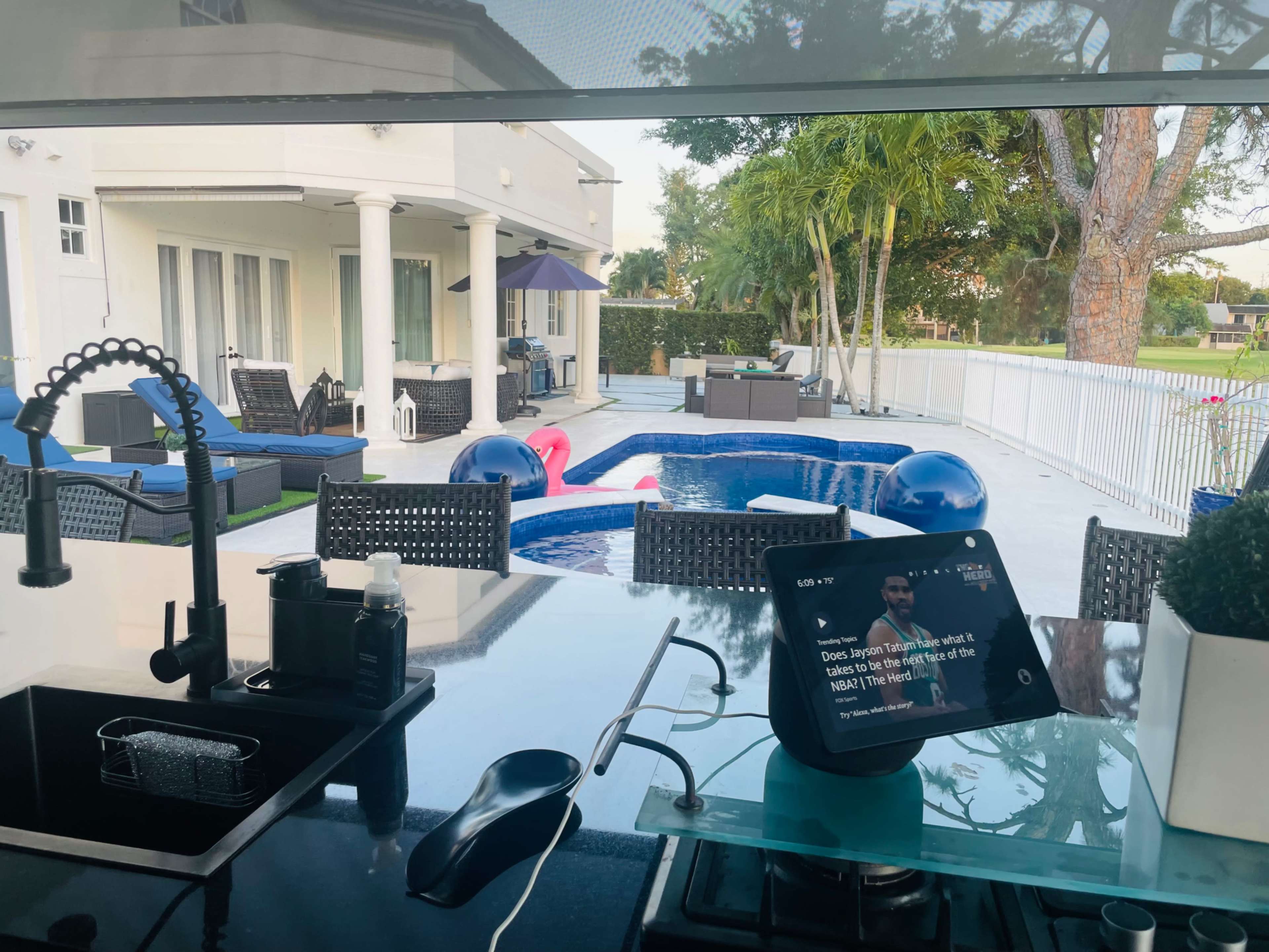 Country club, suburban, outdoor area with pool. Golf course view, roomy area with plenty of seating. Image in Country Club, Miami, FL