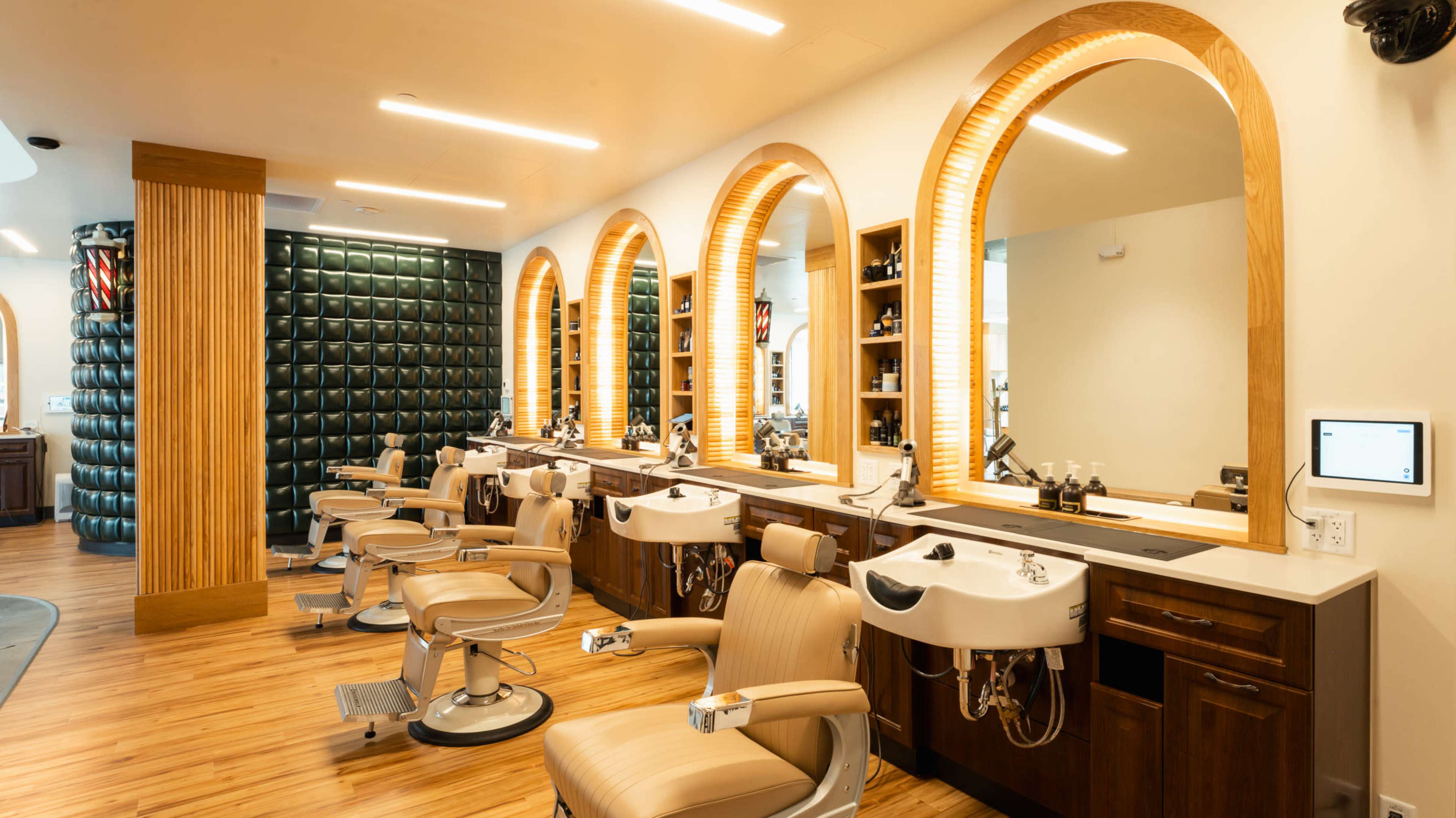 Stylish Barbershop in RiNo — Curved White Wall, Photography Lighting, and Modern Vintage Vibe Image in Five Points, Denver, CO