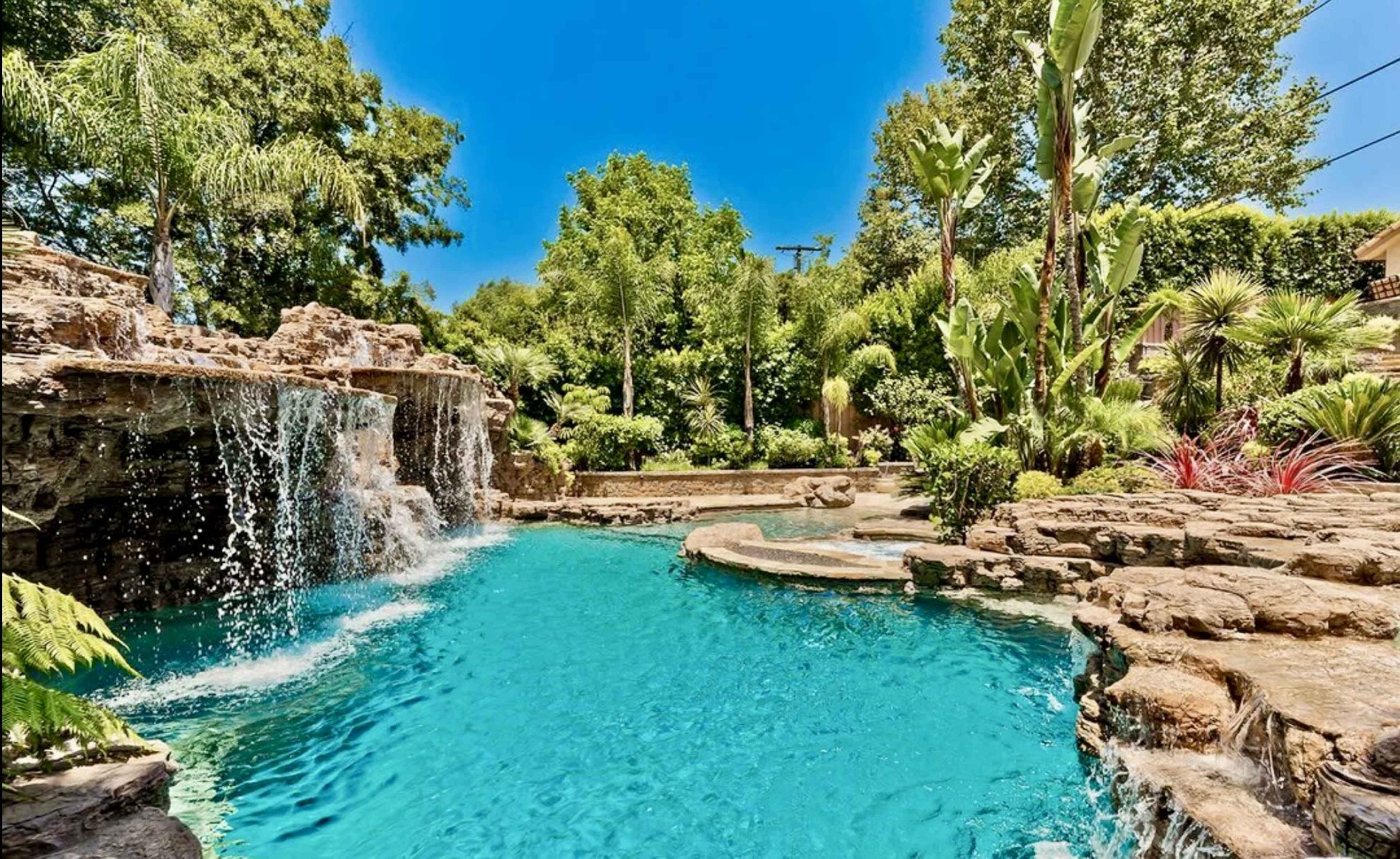 Beautiful Vegas type pool with waterfall and hot tub. Image in Valley Village, Valley Village, CA