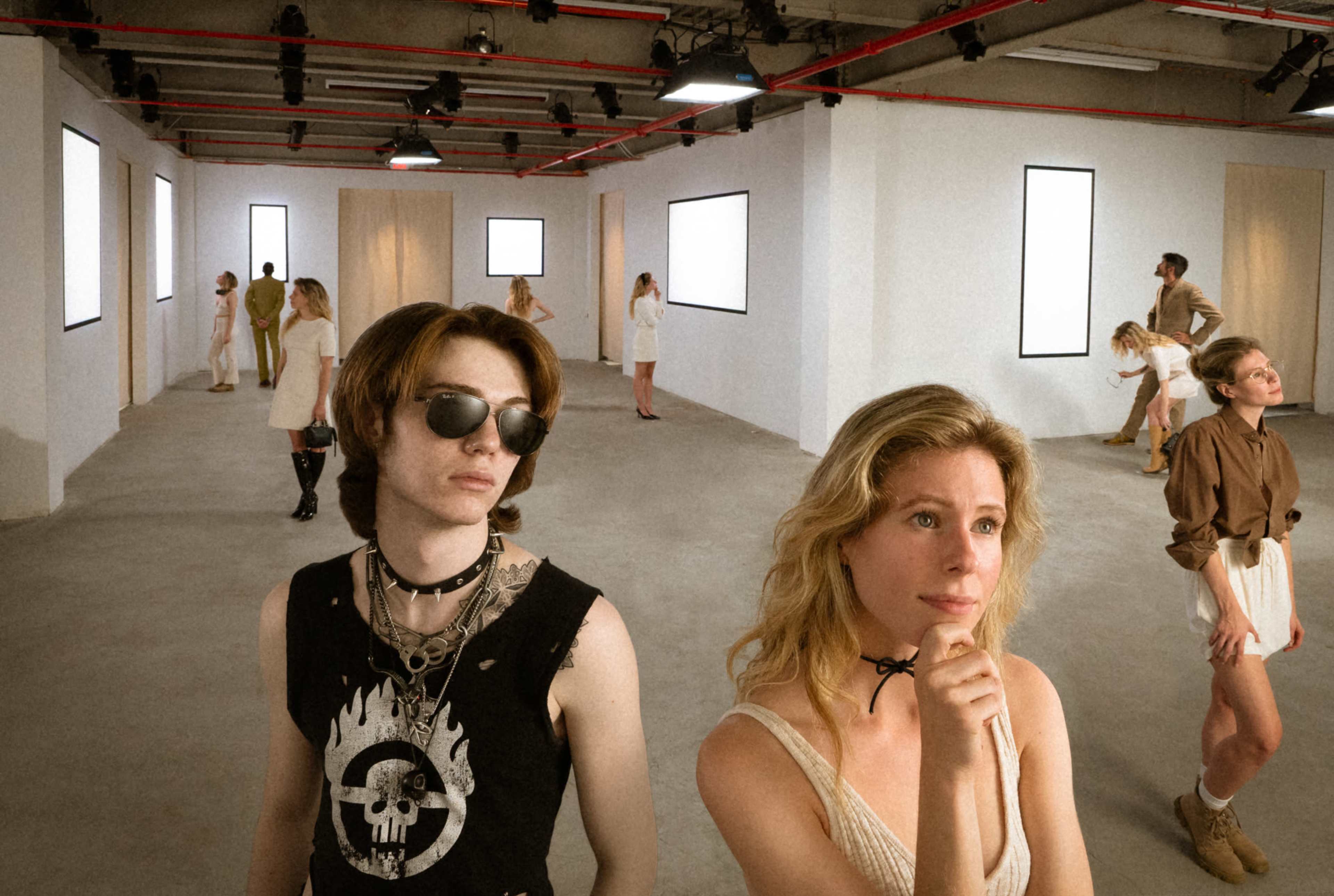 In a modern gallery space with empty walls and minimalist decor, a group of individuals poses and interacts in various sections of the room.
