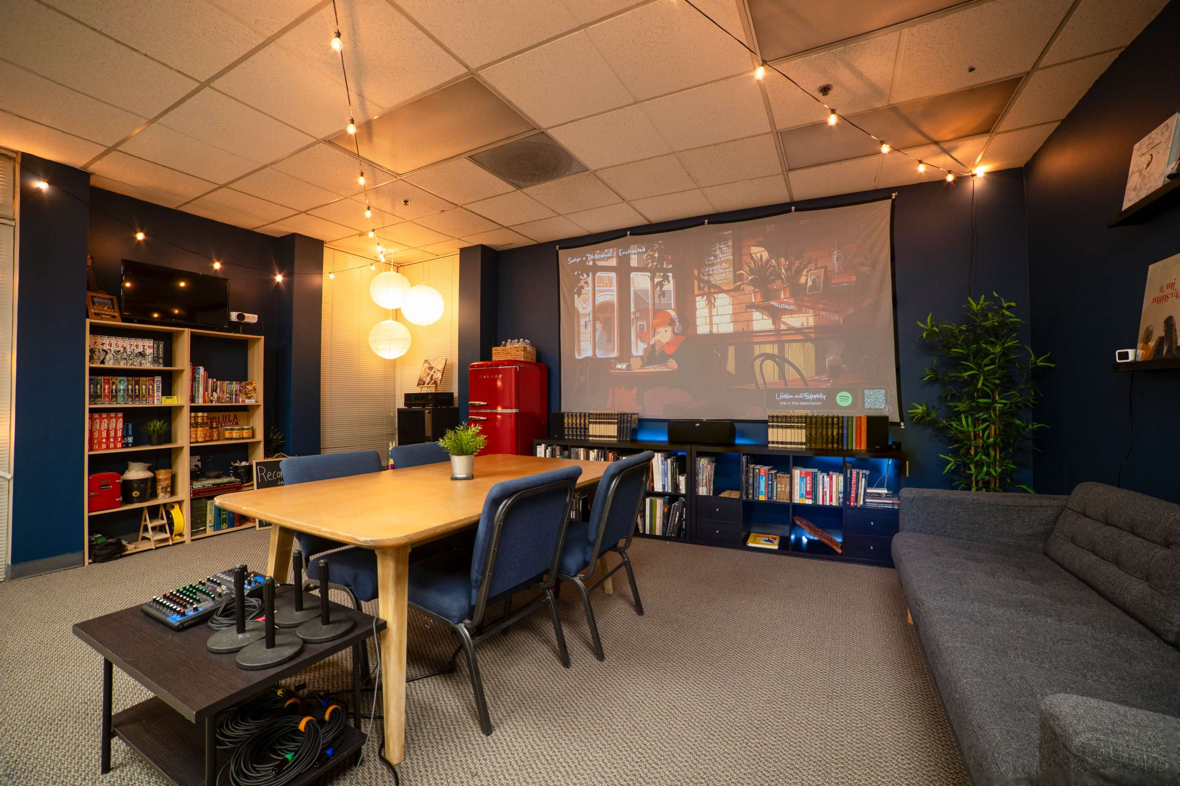 Cozy, Warm Meeting Space with Projector and Writing Materials Image in Northside, Riverside, CA
