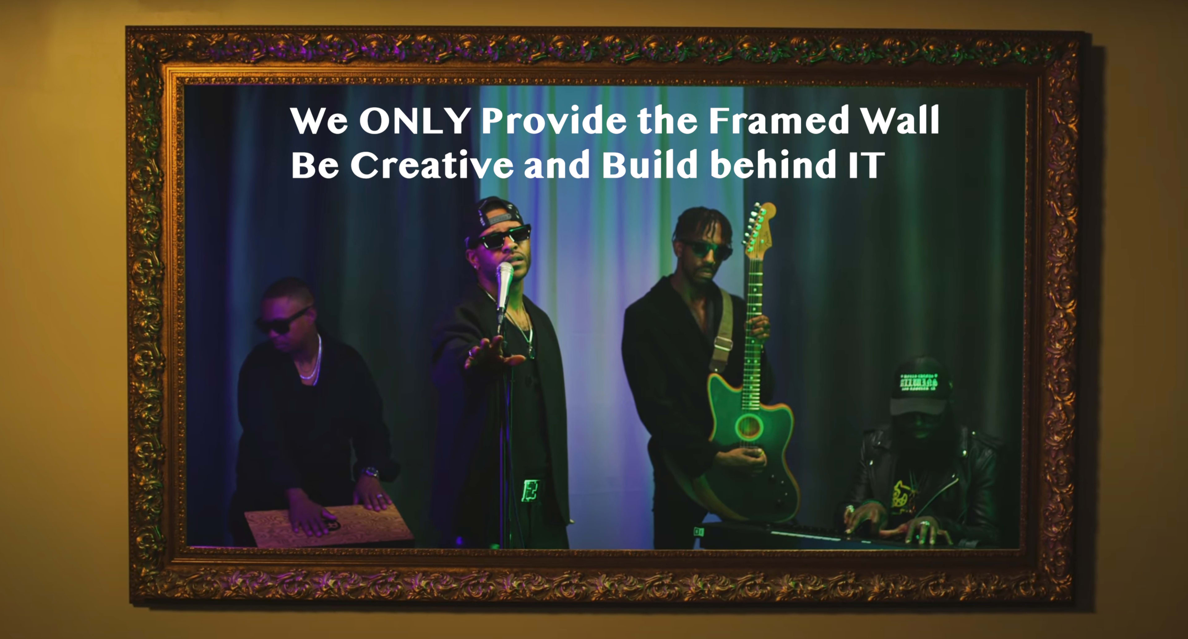 A framed scene of four musicians performing, with one holding a microphone and another playing a green guitar.