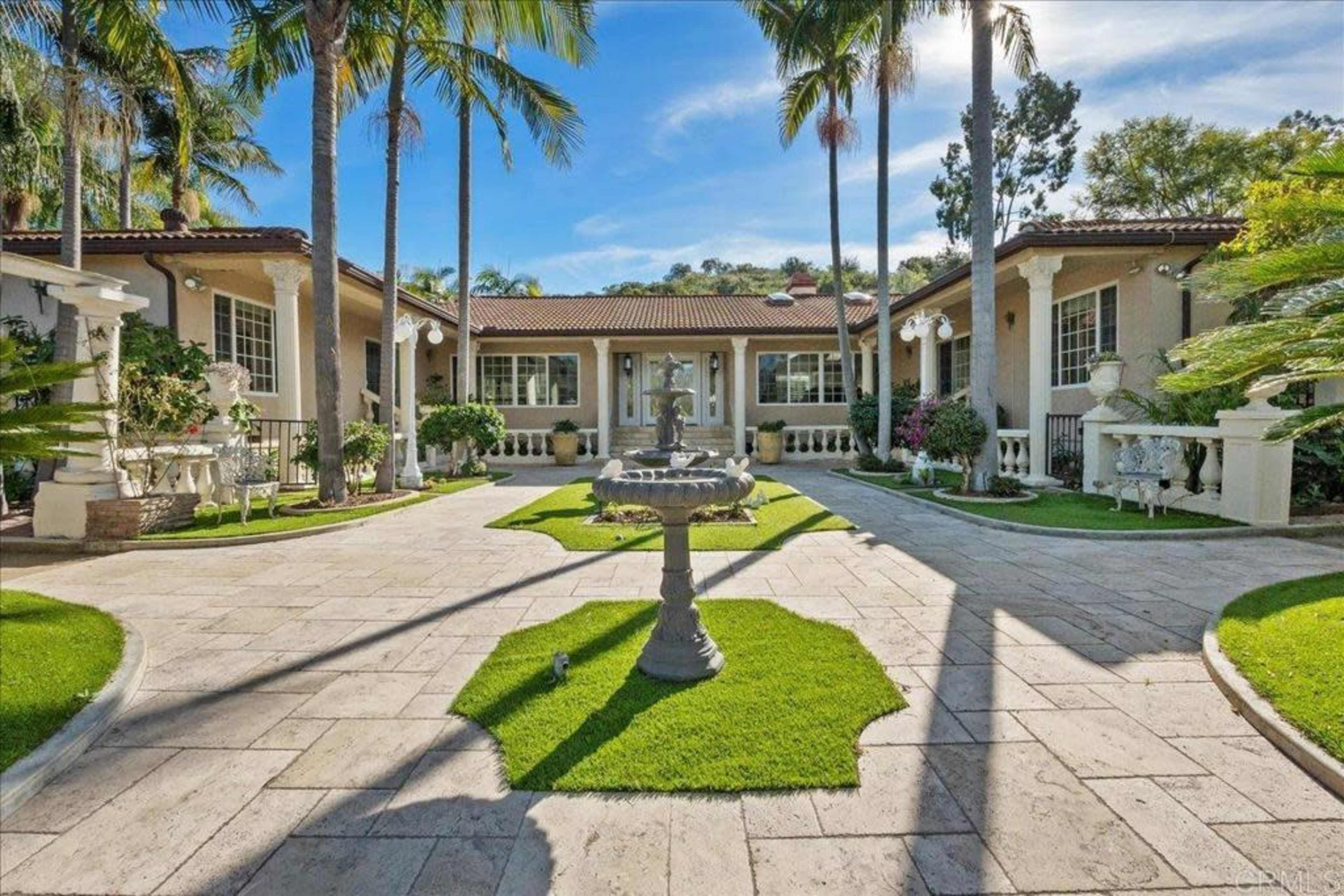 Elegant Outdoor Oasis with Lush Gardens, Pool, and Patios—Perfect for Daytime Events in Vista Image in , Vista, CA