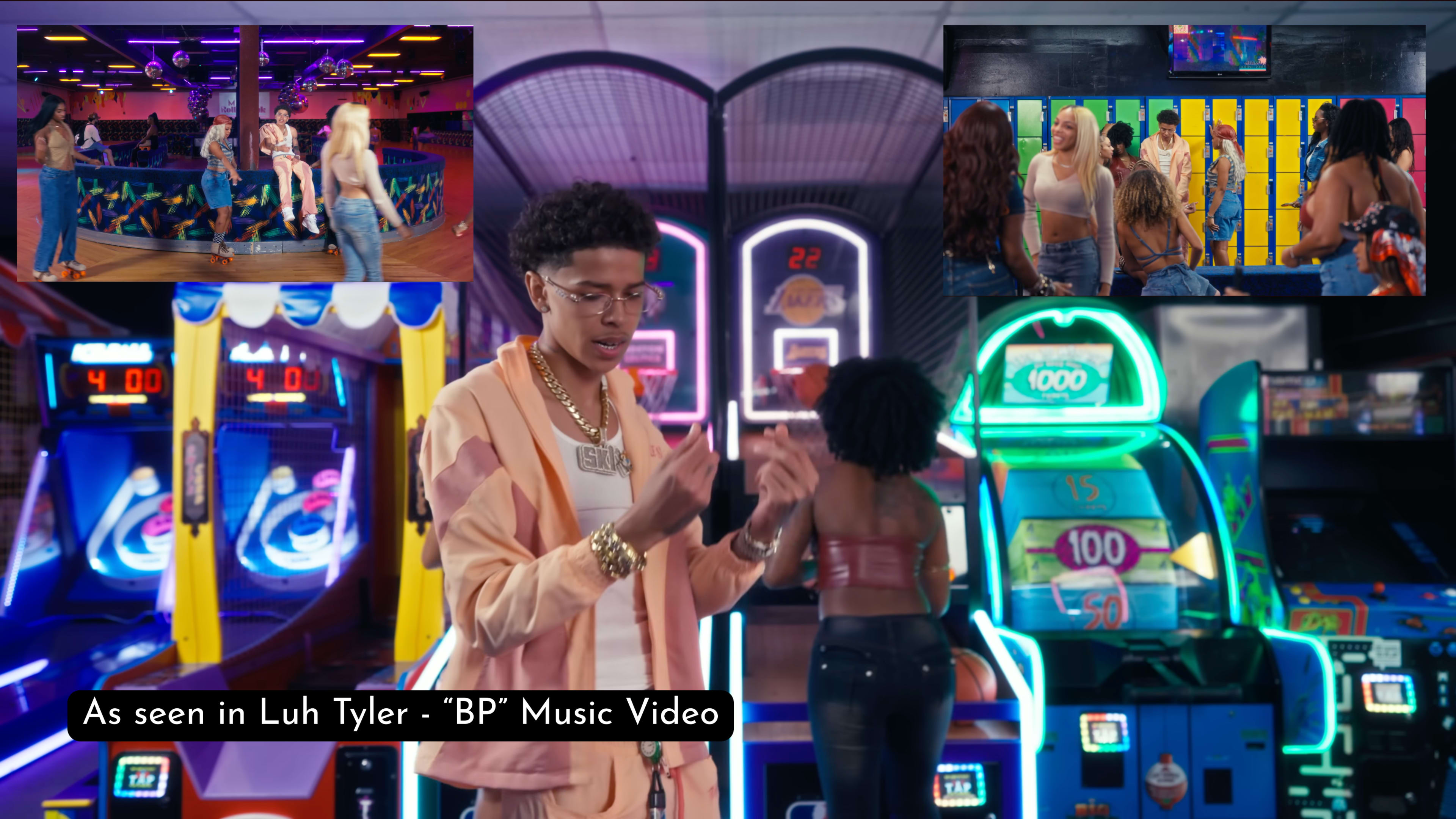 The image features a vibrant arcade scene with a performer in the foreground gesturing, surrounded by colorful gaming machines and groups of people enjoying the atmosphere.