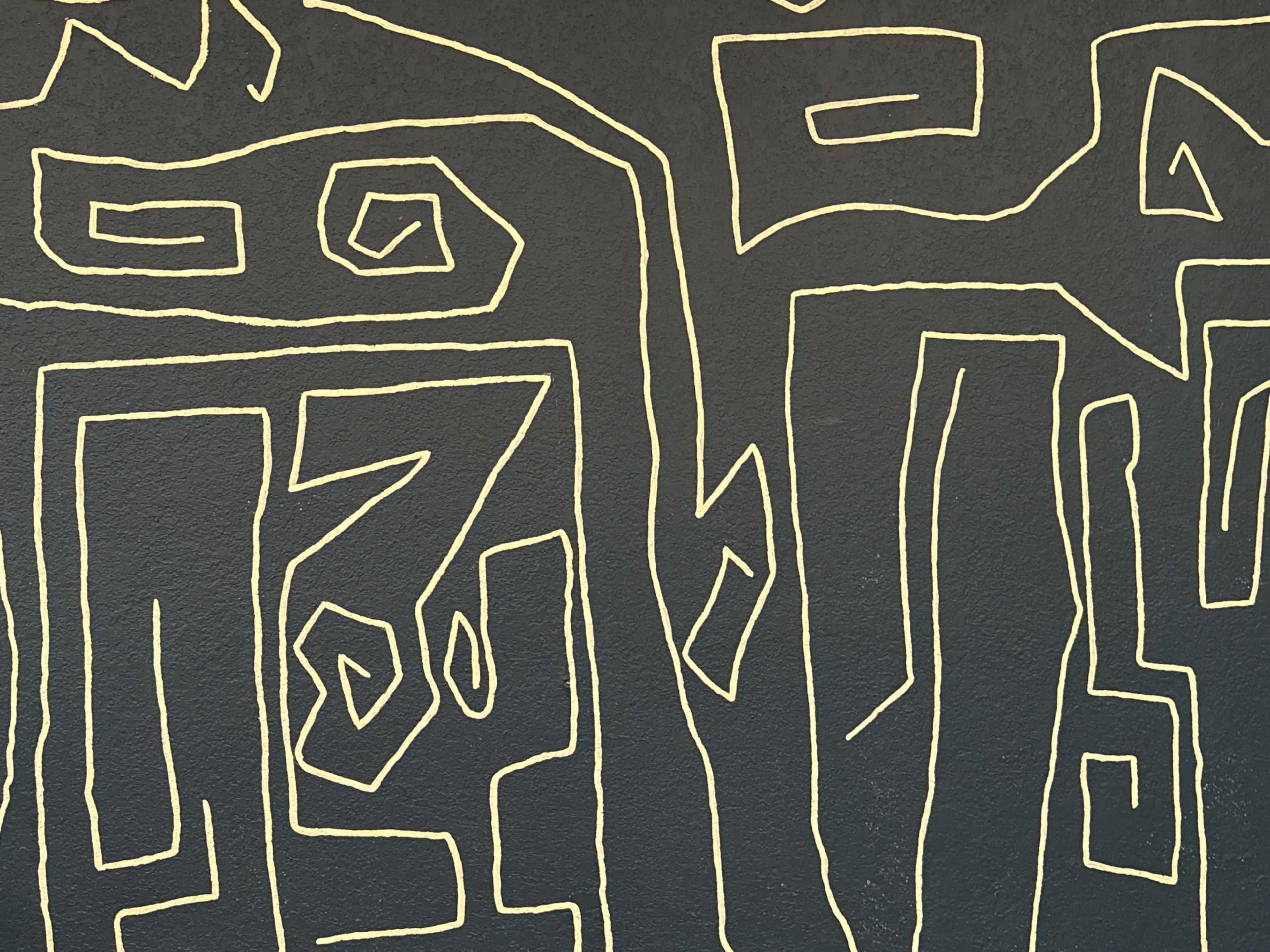 The image shows a textured wall with abstract yellow line patterns against a dark background.