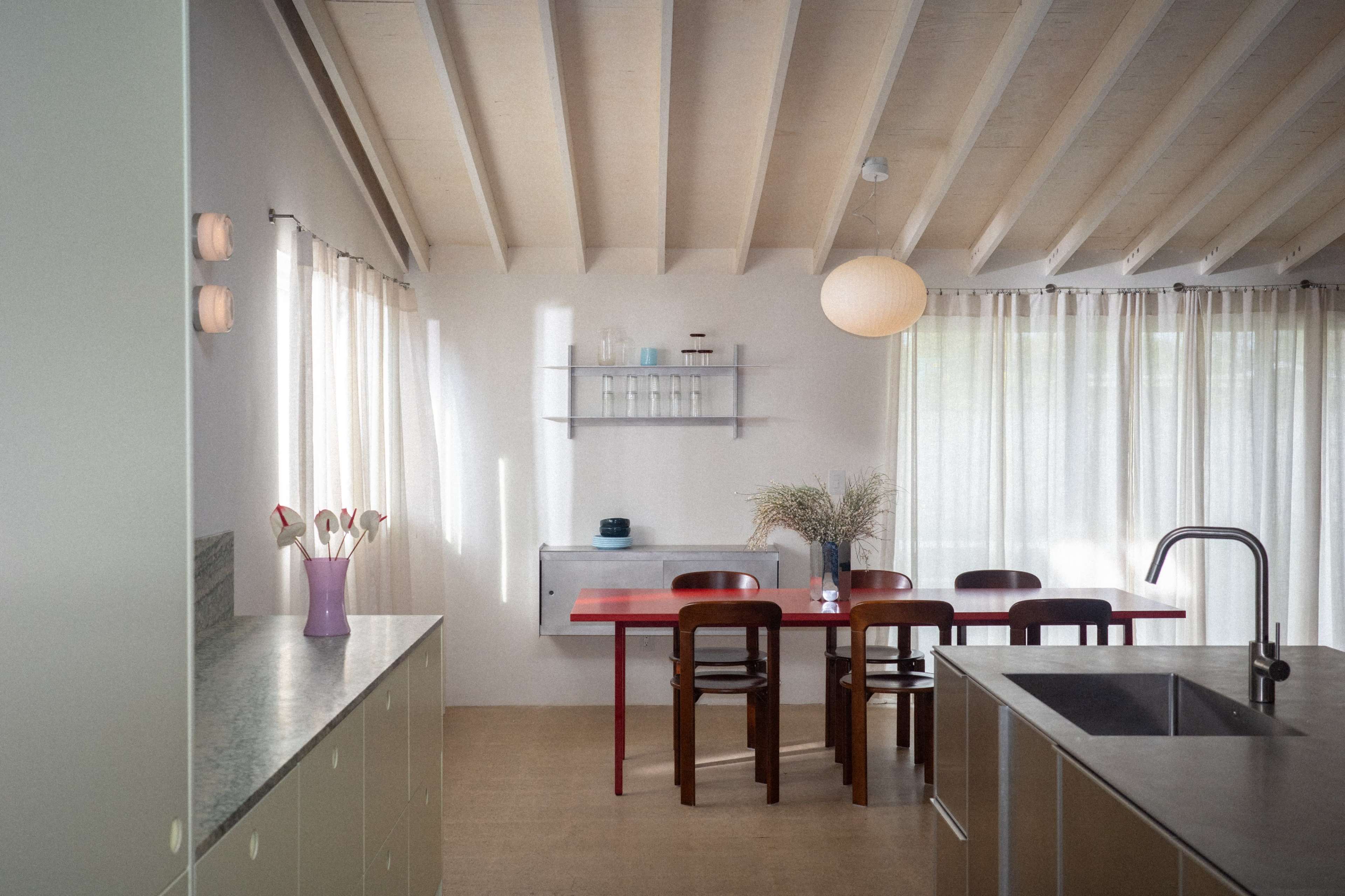 Naturally lit Coastal Ranch with danish kitchen, stainless steel and colorful plywood furniture Image in College Park, Costa Mesa, CA