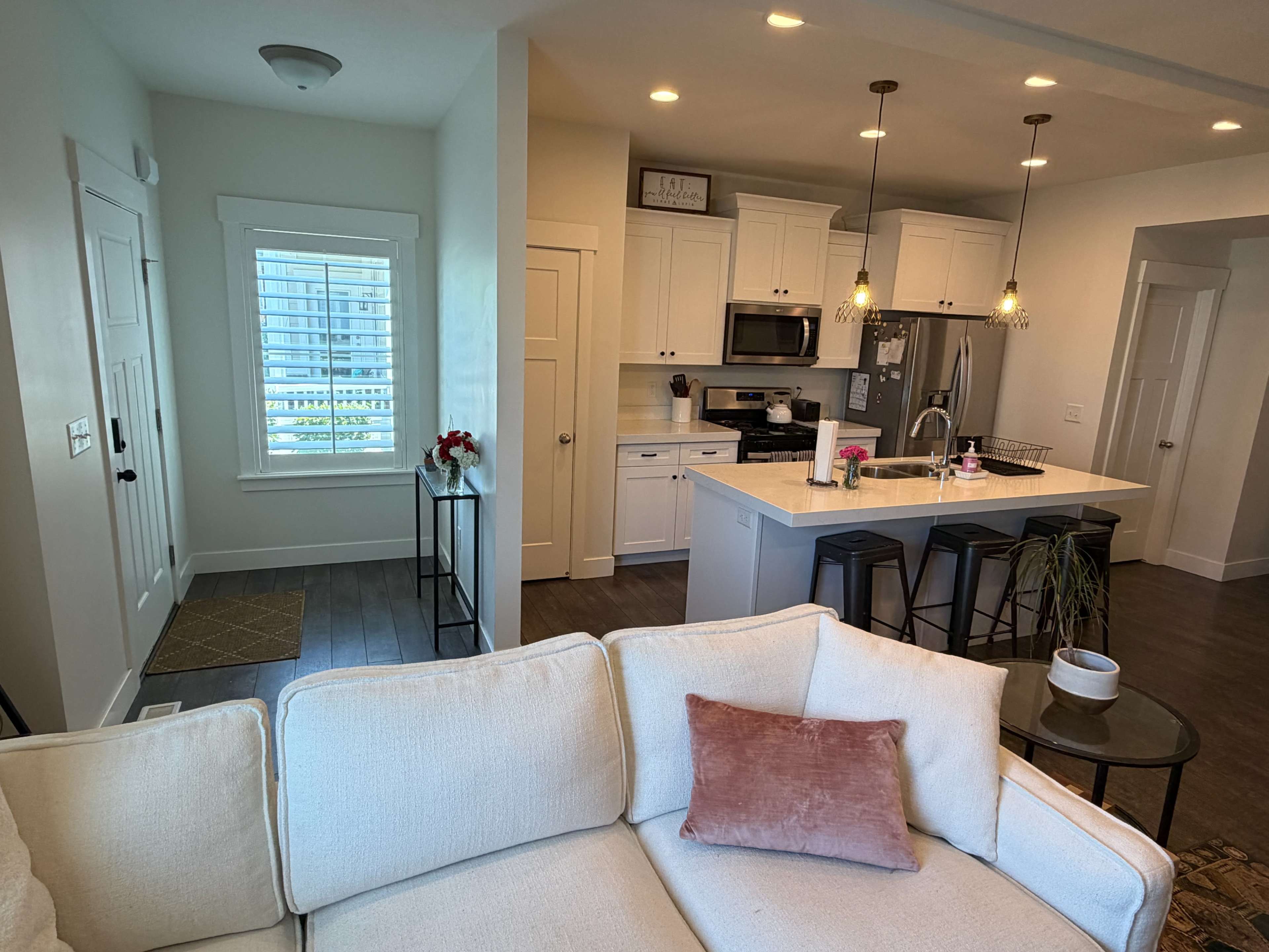 Modern Versatile Townhome with Brick Wall, Living Areas, and Content Creation Space Image in Sandy, Sandy, UT