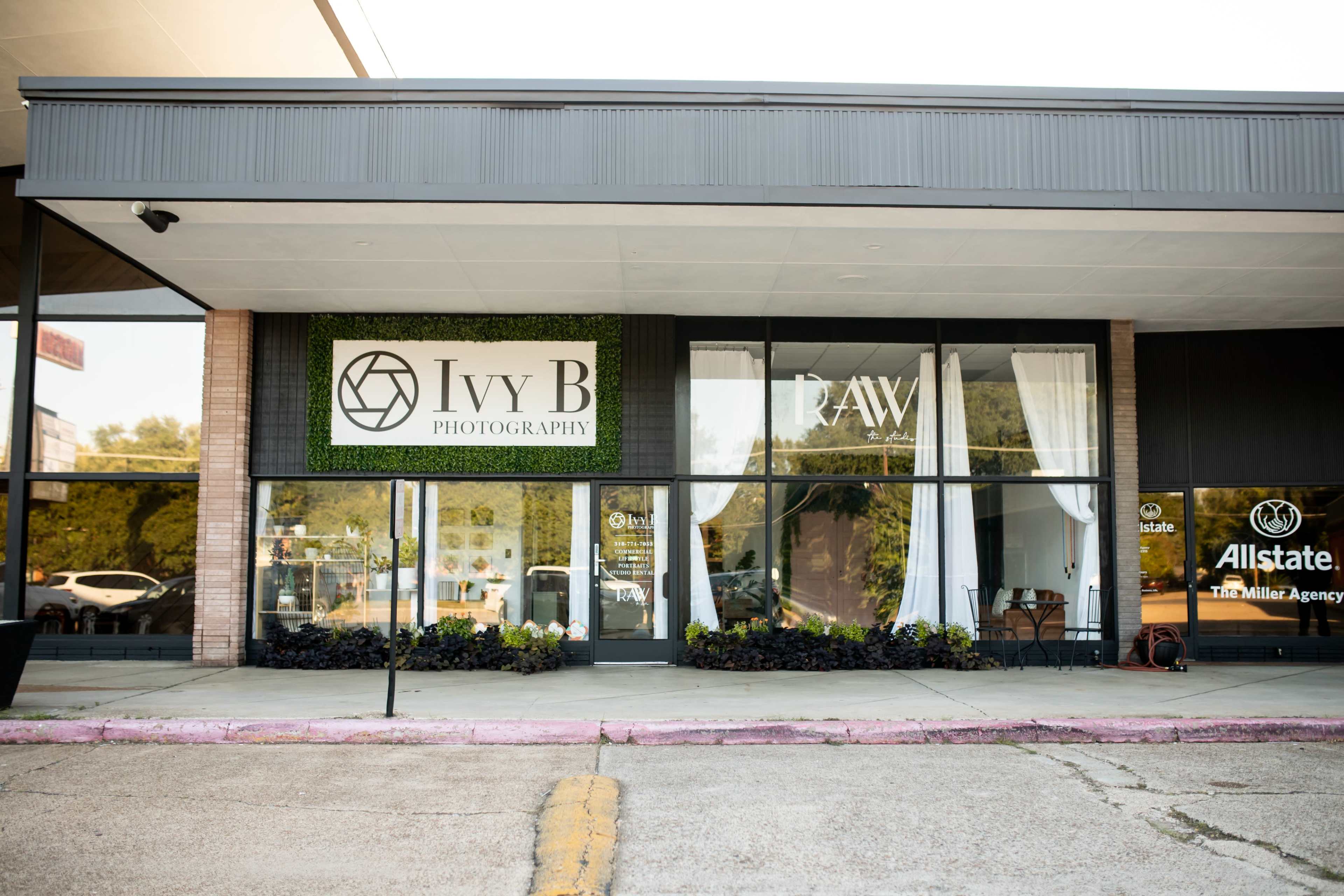 The image shows the façade of a photography studio named "Ivy B Photography," featuring large windows and a sign with greenery, along with other businesses in the vicinity.